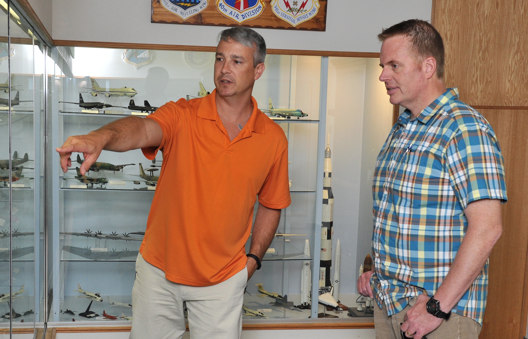 Rob Turnbow, 341st Missile Wing museum director, left, talks to visitor Patrick Connolly June 29, 2015, about the various air missions that have been at Malmstrom Air Force Base, Mont., since the base was founded during World War II. Approximately 250 scale aircraft models are on display at Malmstrom AFB’s museum. The museum is open 10 a.m. to 4 p.m. Monday through Friday but is closed on federal holidays. (U.S. Air Force photo/John Turner)