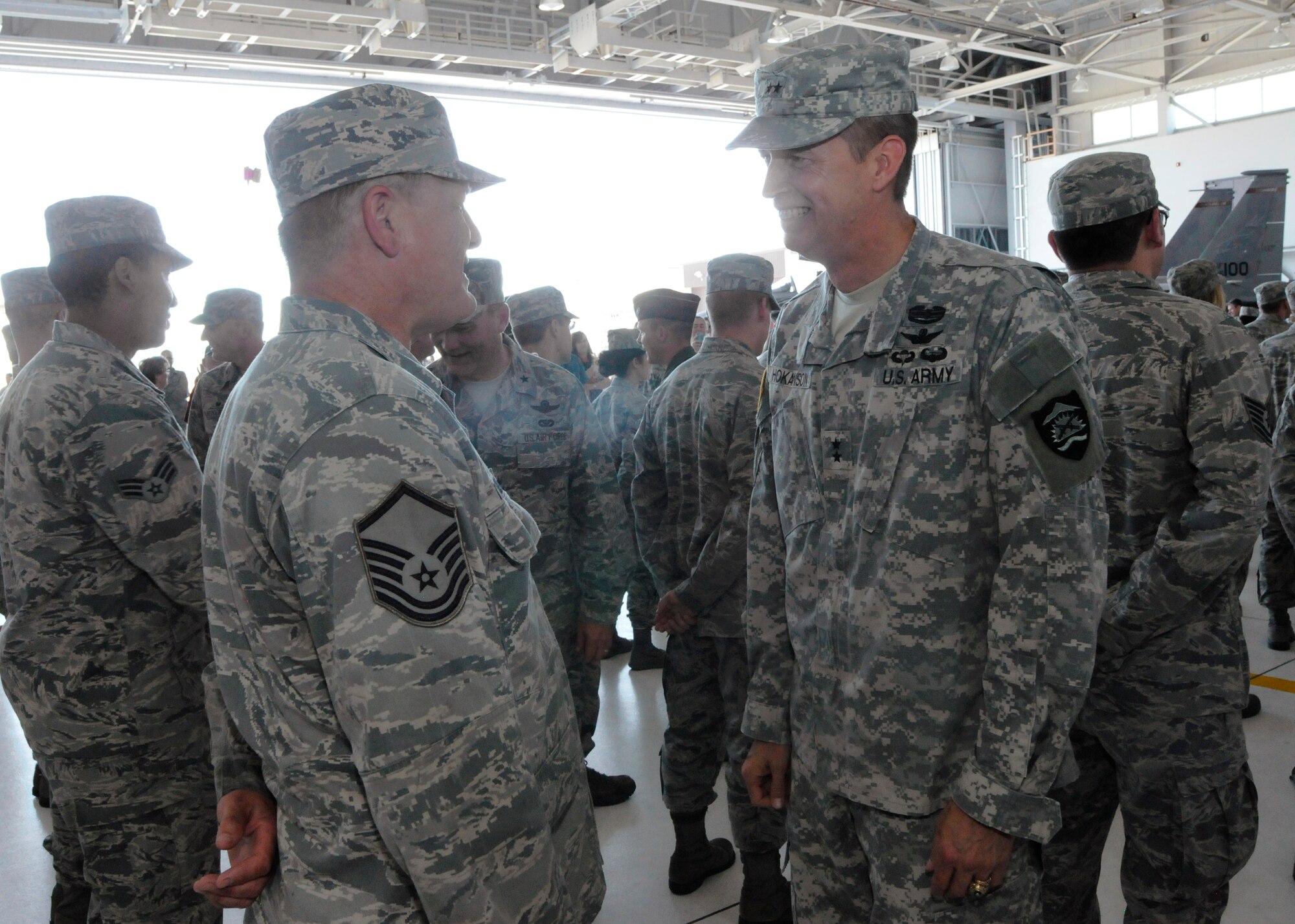 Army Maj. Gen. Daniel Hokanson, Adjutant General for Oregon, right, greets Airmen deploying in support of Operation Atlantic Resolve following the formal mobilization ceremony, June 26, 2015, Portland Air National Guard Base, Ore. (U.S. Air National Guard photo by Tech. Sgt. John Hughel, 142nd Fighter Wing Public Affairs/Released)
