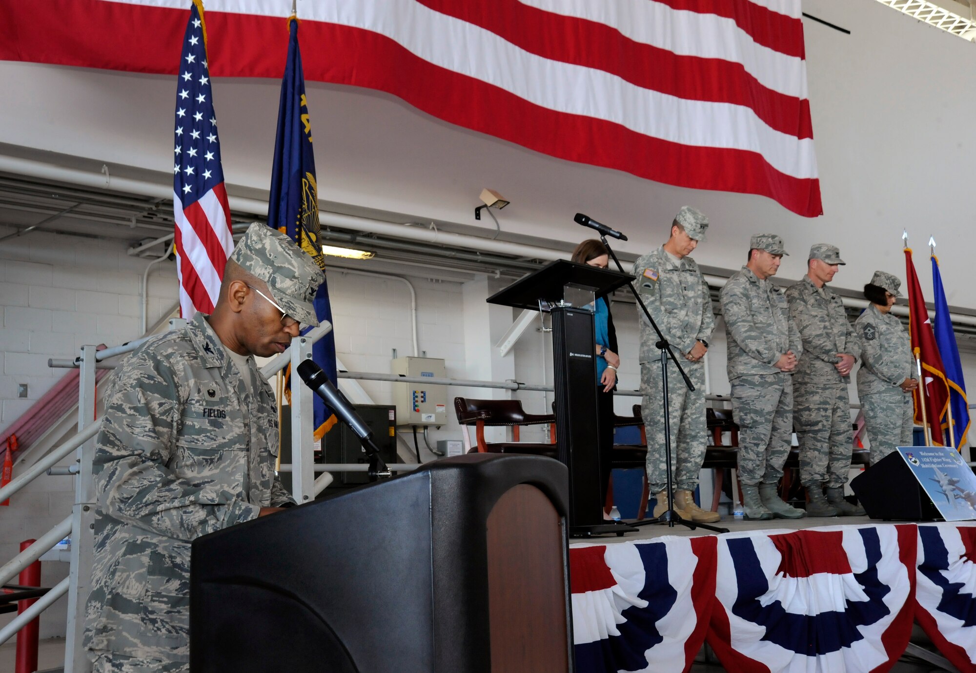 Oregon Air National Guard Col. Michael Fields, 142nd Fighter Wing Maintenance Group commander, delivers the invocation during the 142nd Fighter Wing mobilization ceremony, June 26, 2015, Portland Air National Guard Base, Ore. (U.S. Air National Guard photo by Tech. Sgt. John Hughel, 142nd Fighter Wing Public Affairs/Released)