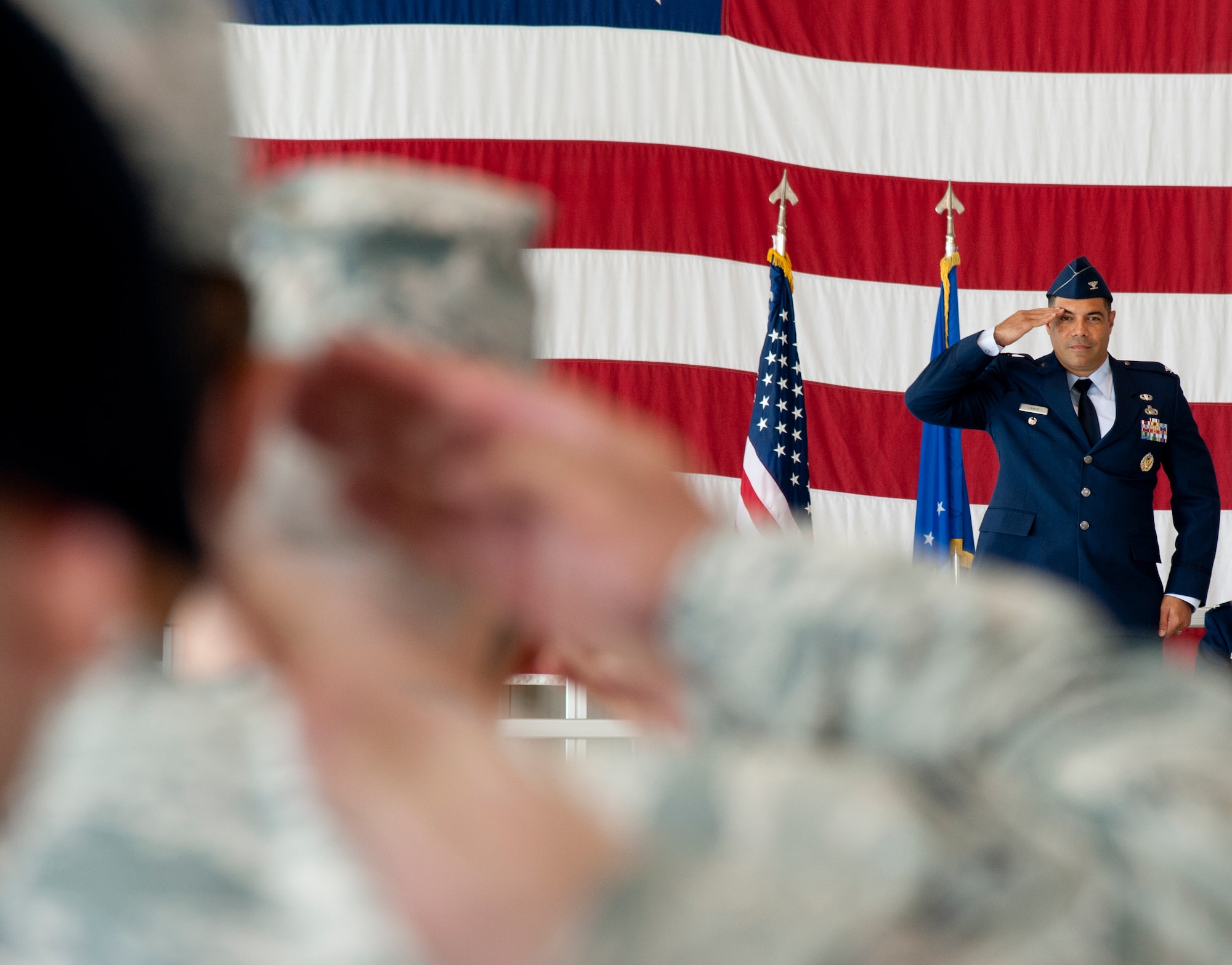 Col. Dwayne LaHaye receives his first salute the Airmen from the 71st Mission Support Group after assuming command of the group during a ceremony in Hangar 199, Vance Air Force Base, Oklahoma, June 26. “To command is to serve, and that’s what I’m here to do,” said Lehay, addressing his new troops. “I am honored and humbled to join your team. Your outstanding reputation precedes you, and I can’t wait to see you in action.” 
 (U.S. Air Force photo / Nancy Falcon)
