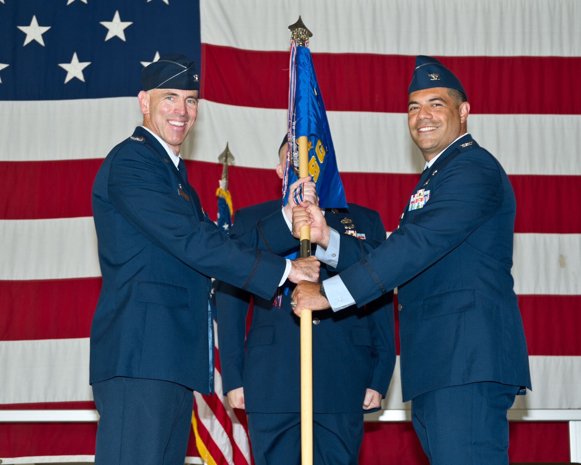 Col. Christopher Daniels hands the 71st Mission Support Group guidon to Col. Clark Quinn, the 71st Flying Training Wing commander, during a change-of-command ceremony at Vance Air Force Base, Oklahoma, June 26. Daniels’ replacement, Col. Dwayne LaHaye, joins Team Vance after a tour with Headquarters Air Combat Command, Joint Base Langley-Eustis, Virginia. (U.S. Air Force photo/Terry Wasson)