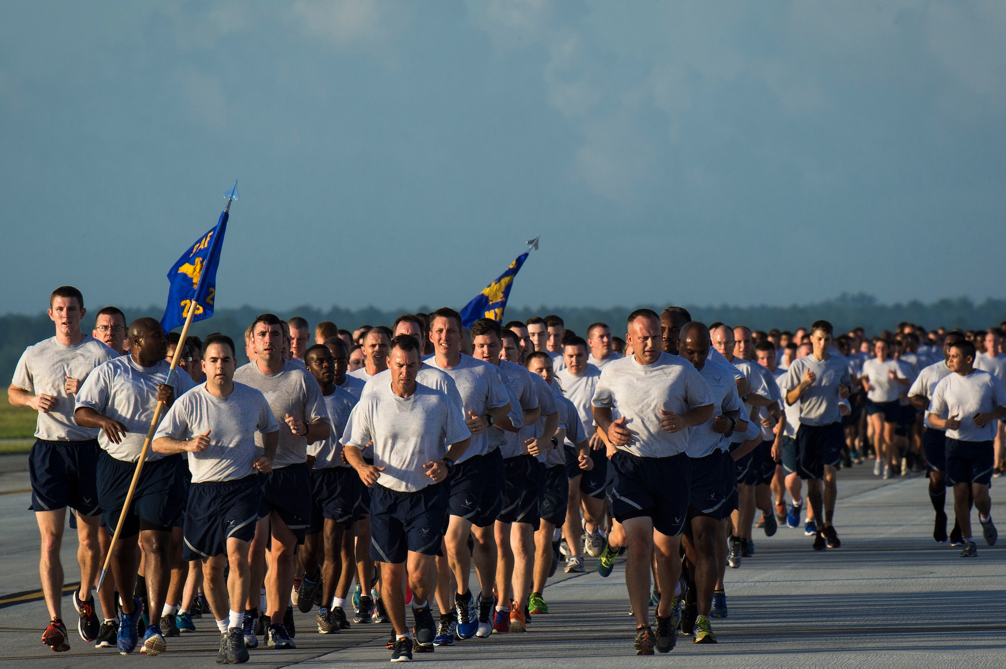 Members of Team Moody run on the flightline during the 23d Wing warrior run June 26, 2015, at Moody Air Force Base, Ga. The run was 2.3 miles long, symbolic of the 23d Wing. (U.S. Air Force photo by Senior Airman Ryan Callaghan/Released)
