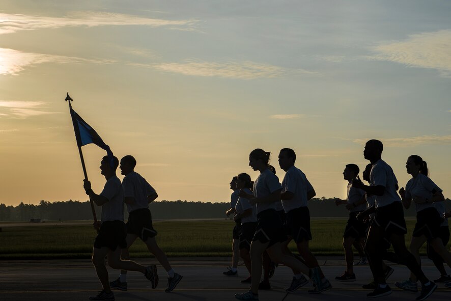 Airmen from the 23d Medical Group run in formation during the 23d Wing warrior run June 26, 2015, at Moody Air Force Base, Ga. The goal of the wing run was to promote physical fitness and esprit de corps. (U.S. Air Force photo by Senior Airman Ryan Callaghan/Released)