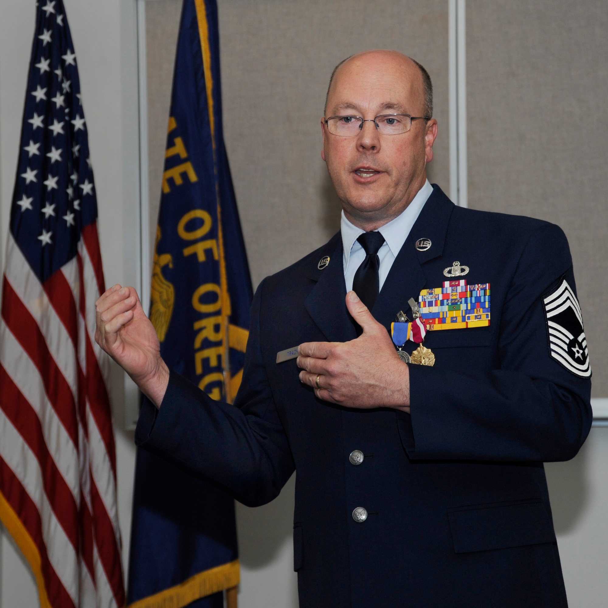 Oregon Air National Guard Chief Master Sgt. Patrick Tracy delivers his final remarks to those attending his formal retirement ceremony, May 2, 2015, Portland Air National Guard Base, Ore. Tracy was assigned to the 142nd Fighter Wing Operations Group, serving as the senior enlisted leader and also was the Team Chief for the Air National Guard’s F-15 Eagle Weapons System Council, Aircrew Flight Equipment. (U.S. Air National Guard by Tech. Sgt. John Hughel, 142nd Fighter Wing Public Affairs Department)