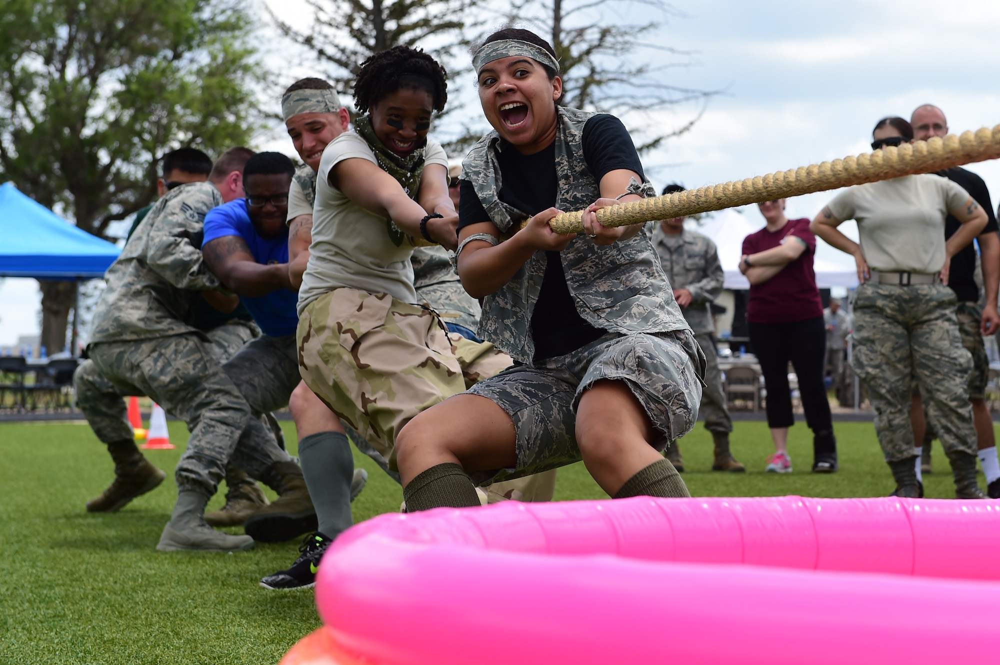 Team Buckley members participate in a tug-o-war during Junior Enlisted Appreciation Day June 26, 2015, at the all-purpose field on Buckley Air Force Base, Colo. Junior Enlisted Appreciation Day is held annually to recognize the efforts of E-4s and below on Buckley AFB. (U. S. Air Force photo by Airman 1st Class Luke W. Nowakowski/Released)