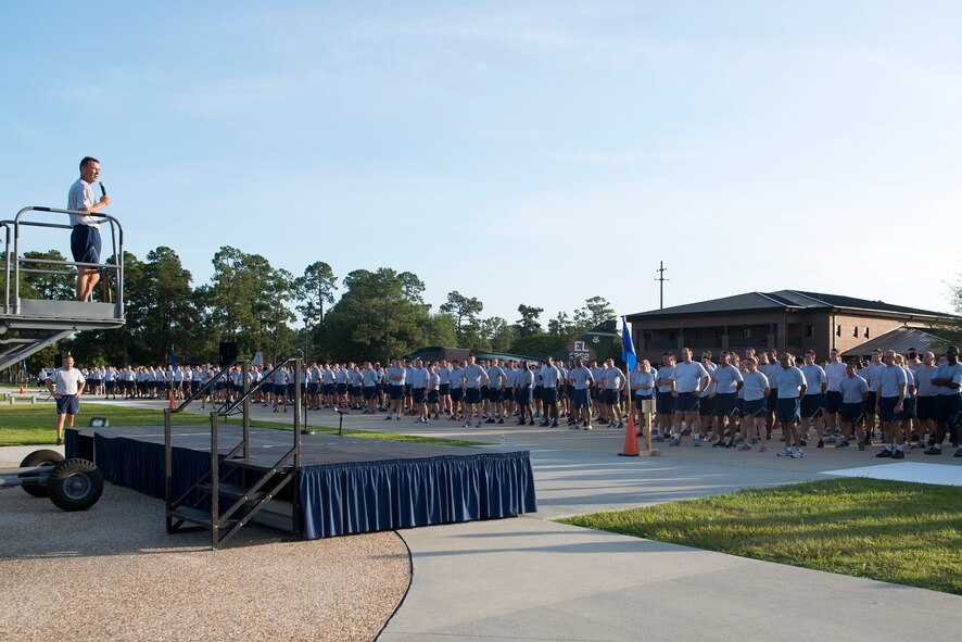 U.S. Air Force Col. Chad Franks, 23d Wing commander, speaks to members of the 23d WG after the Wing warrior run June 26, 2015, at Moody Air Force Base, Ga. More than 1,800 members of Team Moody participated in the 2.3-mile run with Franks. (U.S. Air Force photo by Airman 1st Class Kathleen D. Bryant/Released)