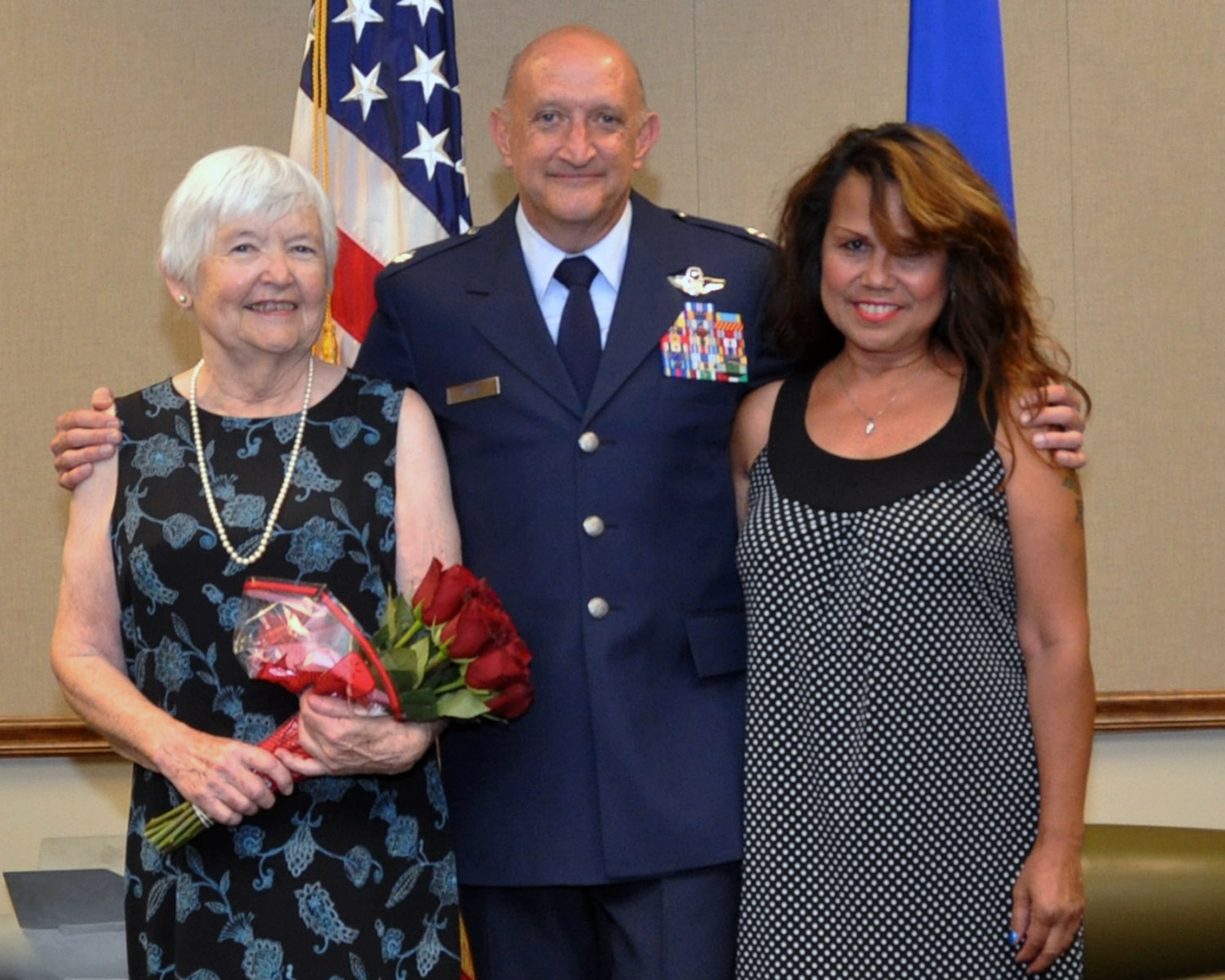 U.S. Air Force Lt. Col. Tim Mers stands with his mother, Barbara Mers, and girlfriend, Grace Dillon, after his retirement ceremony on June 26, 2015 at Barksdale Air Force Base, La. Colonel Mers retired from the Air Force Reserve as an Instructor Weapons System Officer with over 30 years of service and 7,000 flying hours. (U.S. Air Force photo by Master Sgt. Laura Siebert/Released)