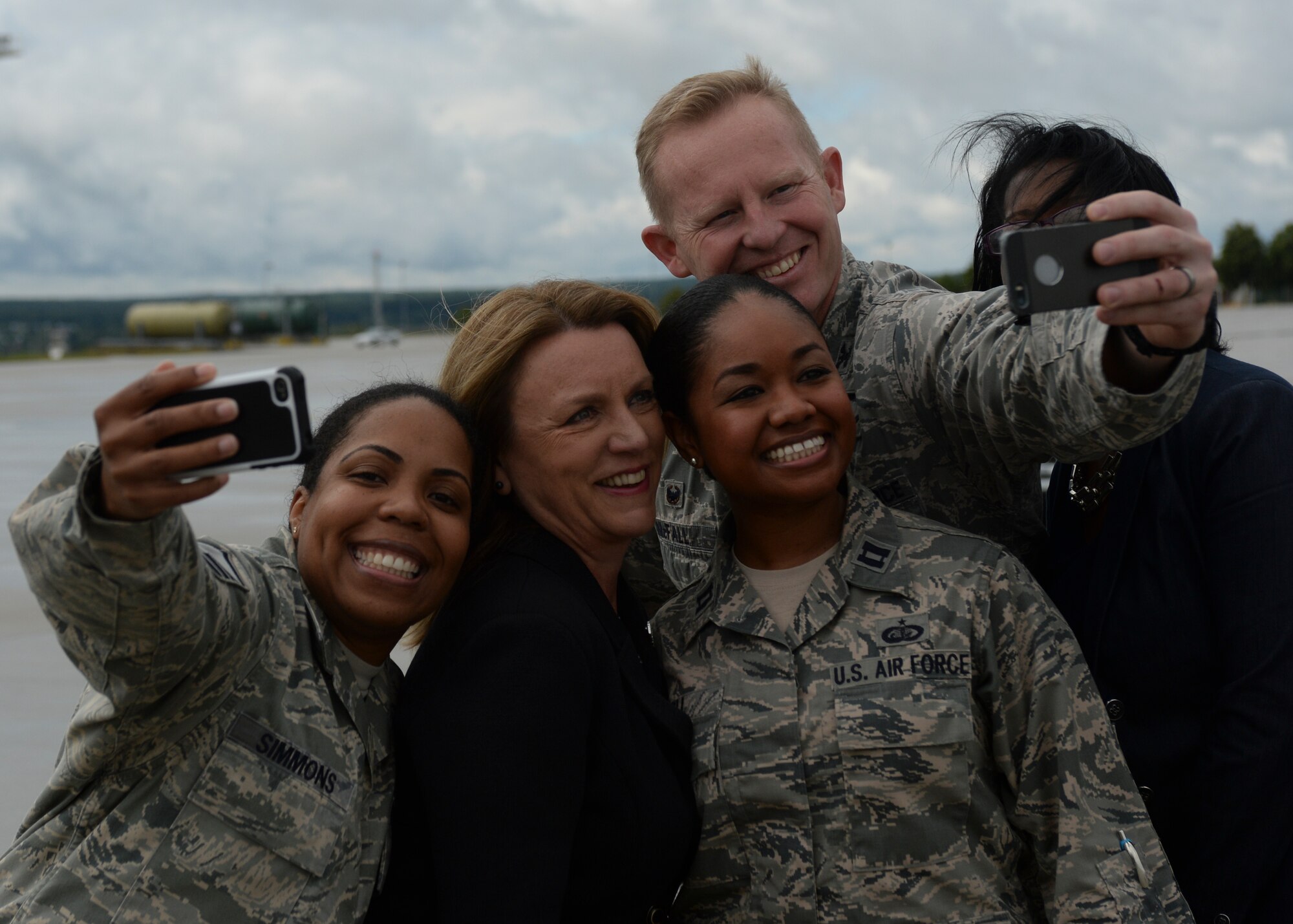 Deborah Lee James, Secretary of the U.S. Air Force, poses for a photo with U.S. Air Force Airmen assigned to the 52nd Fighter Wing during her visit of Spangdahlem Air Base, Germany, June 23, 2015. The Secretary completed a visit of installations through Europe June 24, 2015, to meet Airmen, community leaders and allied and partner nation defense chiefs. (U.S. Air Force photo by Staff Sgt. Joe W. McFadden/Released)