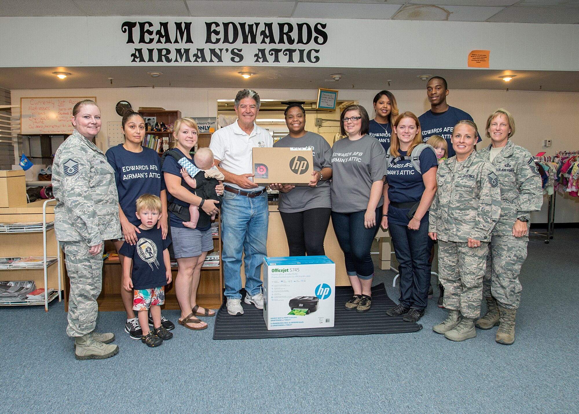 Base volunteers at the Airman’s Attic meet with John Sergione from the Civilian-Military Support Group June 25 to receive donations. The Civ-Mil organization received a lap top and printer to the Airman’s Attic. The Edwards AFB Civilian-Military Support Group exists to create a friendly association between civic leaders and military personnel at Edwards. Civ-Mil acts as a host group when needed and finds annual service projects to improve the general quality of life on base. (U.S. Air Force photo by Edward Cannon)