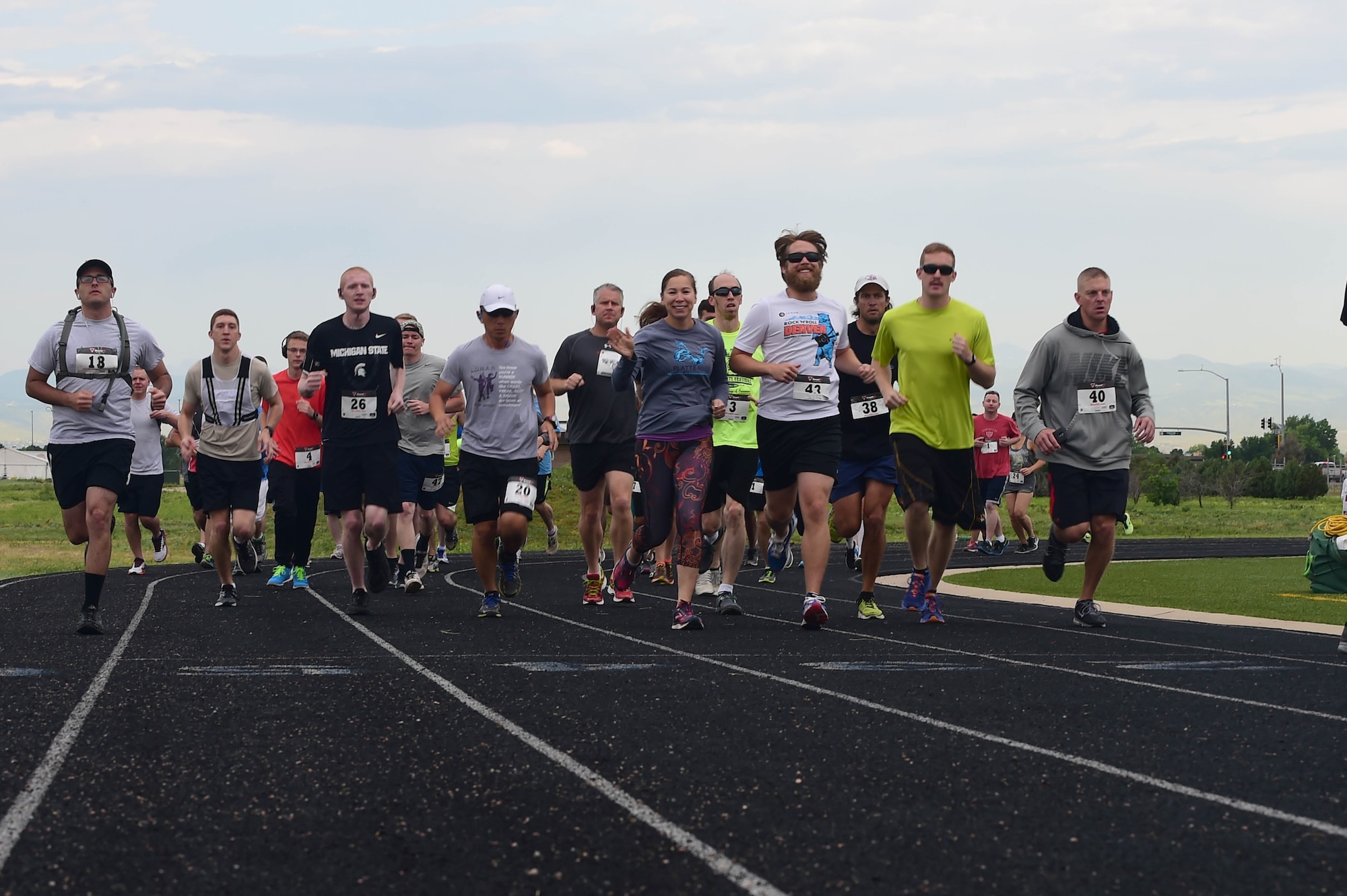 Team Buckley members embark on a 12k run as part of the Dash to Distance series June 25, 2015, at the all-purpose field on Buckley Air Force Base, Colo. The Dash to Distance series started with a 5k and will gradually build up to a half-marathon run. Prizes were awarded to the top male and female finishers, along with Commander’s Cup points. (U.S. Air Force photo by Airman 1st Class Luke W. Nowakowski/Released)