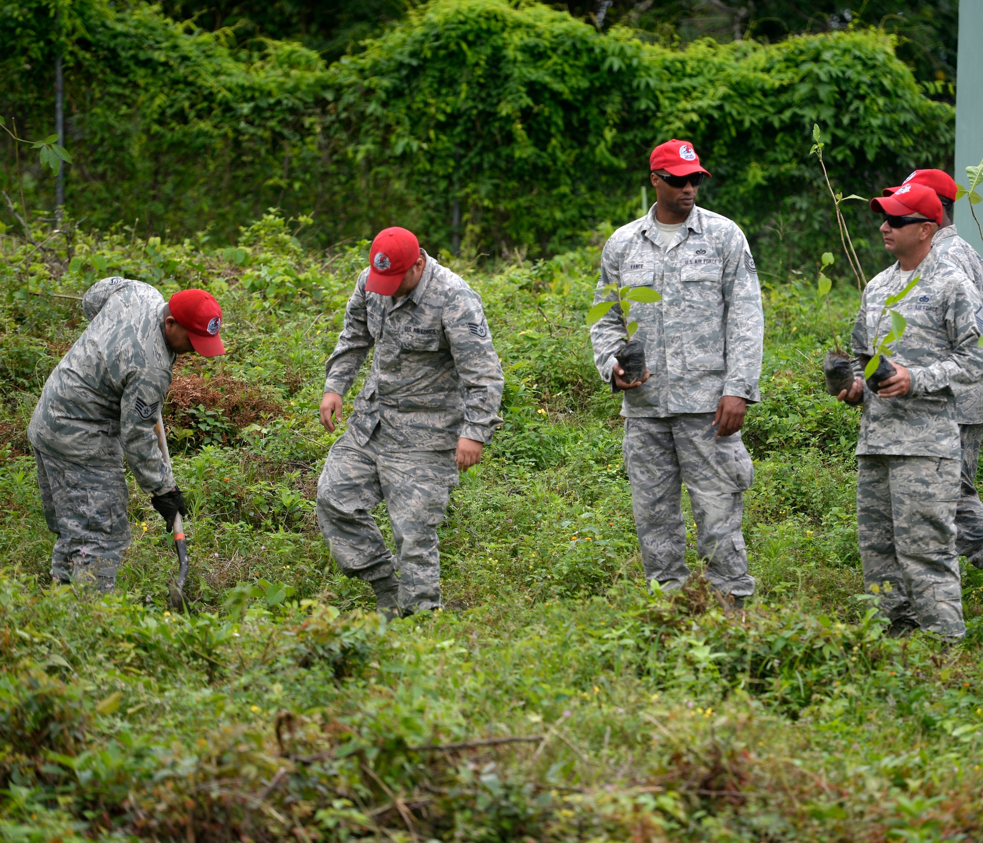 NEW HORIZONS Honduras 2015 personnel participate in the National Tree Day celebration at Rafeal Peneda Ponce School in Trujillo, Honduras, June 19, 2015. NEW HORIZONS Honduras 2015 personnel were at the event in between providing support throughout the Trujillo and Tocoa regions of Honduras by building a new two-classroom schoolhouse in Ocotes Alto, drilling a well in Honduras Aguan, and proving general medical support. NEW HORIZONS was launched in the 1980s and is an annual joint humanitarian assistance exercise that U.S. Southern Command conducts with a partner nation in Central America, South America or the Caribbean. The exercise improves joint training readiness of U.S. and partner nation civil engineers, medical professionals and support personnel through humanitarian assistance activities. (U.S. Air Force photo by Capt. David J. Murphy/Released)