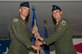 Col. Brian Afflerbaugh, 4th Operations Group commander, passes the guidon to Lt. Col. Lucas Teel, incoming 336th Fighter Squadron  commander, June 26, 2015, at Seymour Johnson Air Force Base, North Carolina. Teel previously served as the 335th FS director of operations before assuming command of the 336th FS. (U.S. Air Force photo/Airman Shawna L. Keyes)  