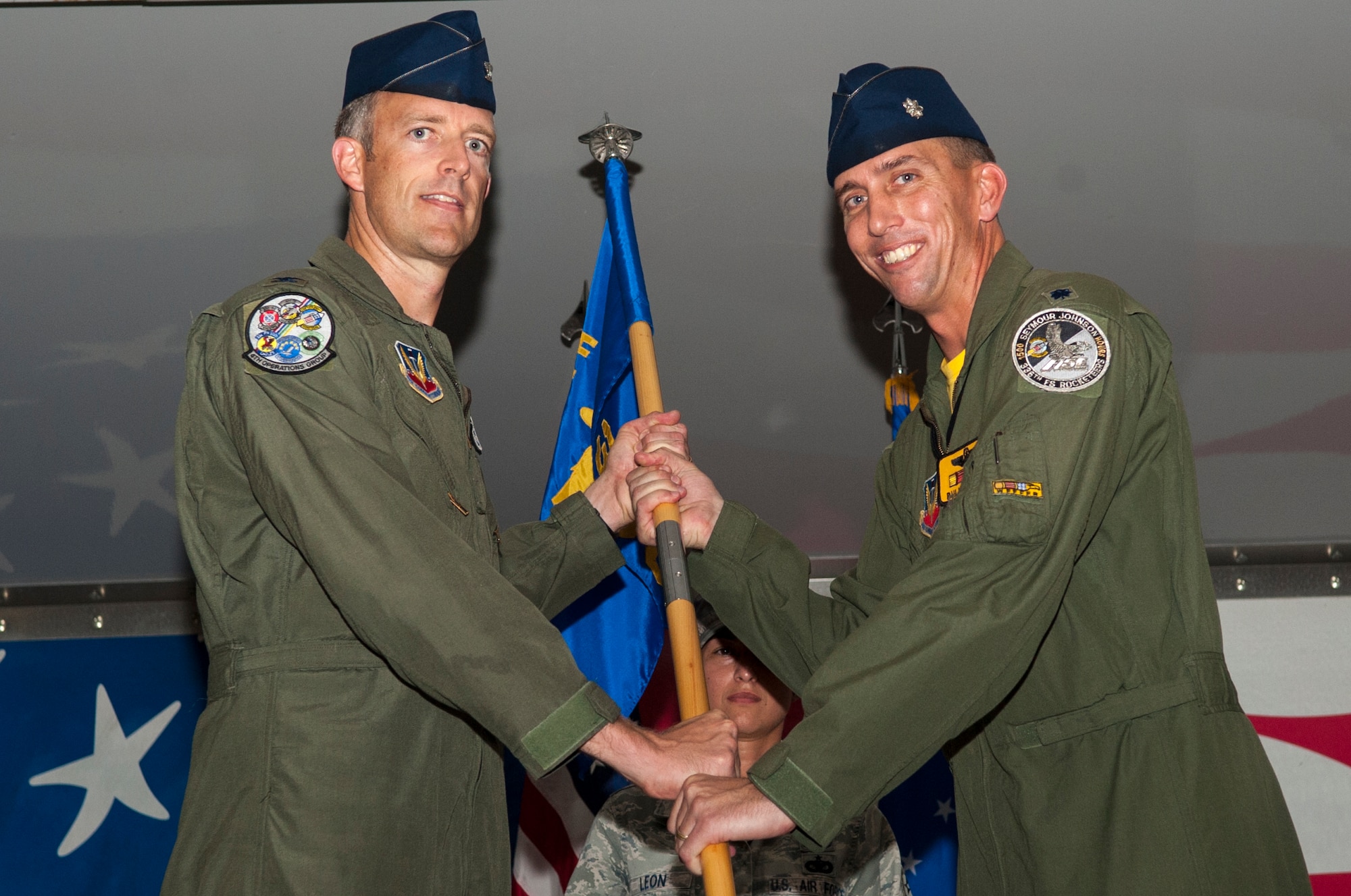 Col. Brian Afflerbaugh, 4th Operations Group commander, accepts the guidon from Lt. Col. Bryce Silver, outgoing 336th Fighter Squadron commander, June 26, 2015, at Seymour Johnson Air Force Base, North Carolina. Silver’s next assignment will take him to Joint Advanced Warfighting School in Norfolk, Virginia. (U.S. Air Force photo/Airman Shawna L. Keyes)