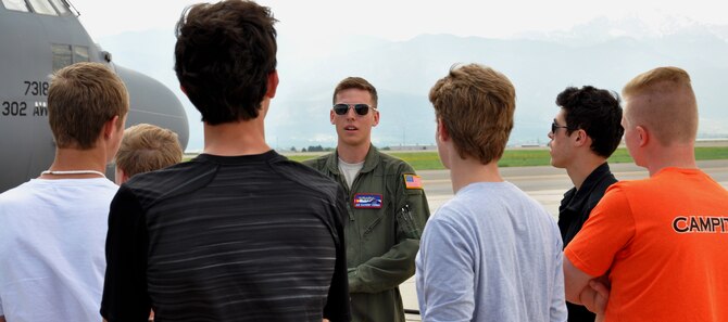 PETERSON AIR FORCE BASE, Colo. – Airman 1st Class Zackery Koenig, center, explains the capabilities of the C-130 Hercules to students of the Aviation Education Foundation of Colorado during their tour of the Air Force Reserve Command’s 302nd Airlift Wing June 23, 2015. Besides touring the C-130 the group also received a wing mission and Modular Airborne Fire Fighting System briefing. The AEFoC provides charitable and educational aviation related training and scholarships to young people in Colorado. Koenig is a C-130 loadmaster. (U.S. Air Force photo/Master Sgt. Daniel Butterfield)