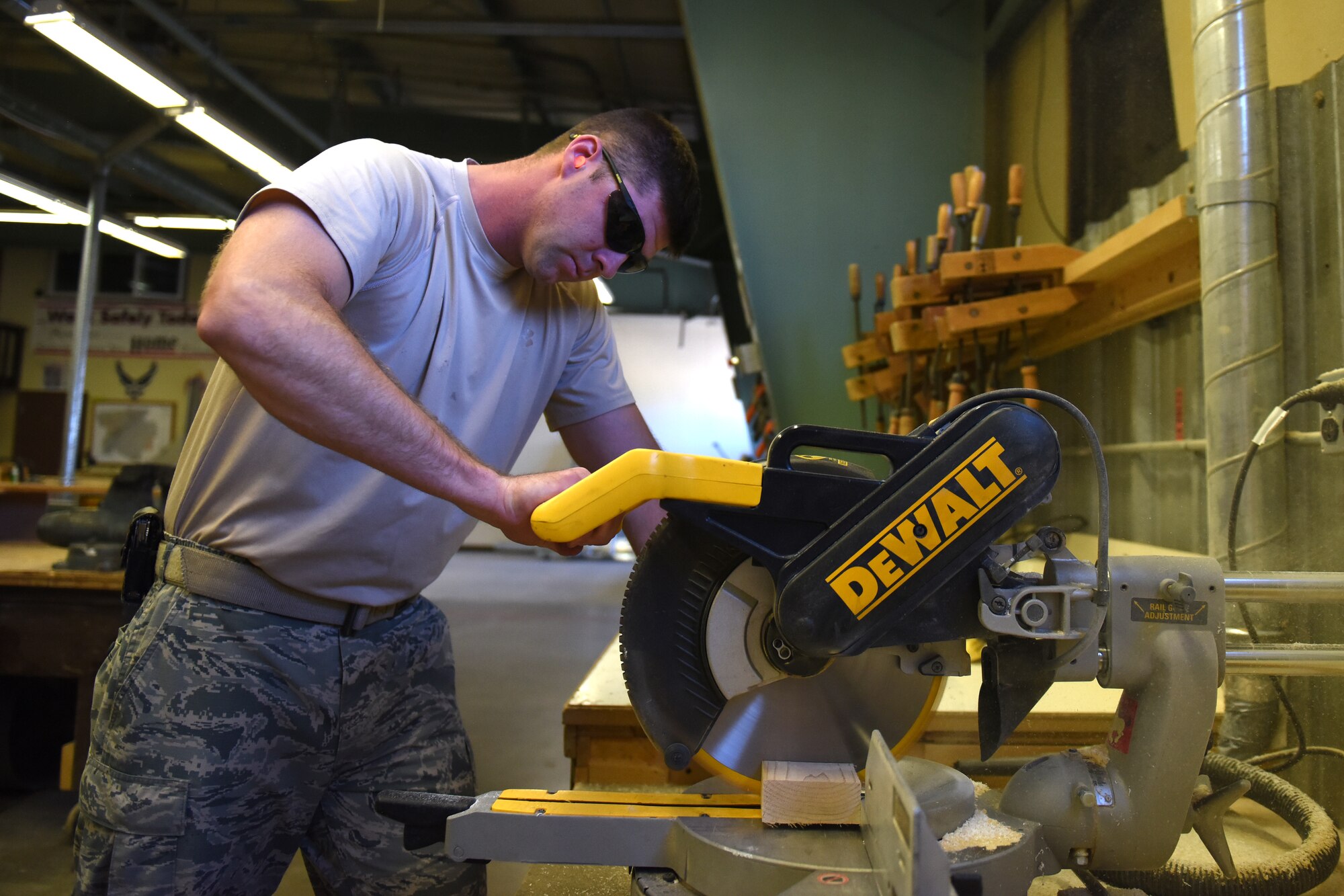 Staff Sgt. Jacob Richey, 341st Civil Engineer Squadron carpenter shop NCO in charge, cuts through a loading beam June 26, 2015, at Malmstrom Air Force Base, Mont. The shop has personnel made up of civilian and active duty, and encompass four sub-sections: carpentry, metal, locksmith and sign shop. (U.S. Air Force photo/Chris Willis)