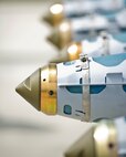 Finished, inert GBU-38 munitions sit awaiting disassembly after being assembled by Airmen from the 5th Munitions Squadron at Minot Air Force Base, N.D., June 25, 2015. According to the official U.S. Air Force website, the GBU-38 is a guided air-to-surface weapon with a range of up to 15 miles. (U.S. Air Force photo/Airman 1st Class Justin T. Armstrong)