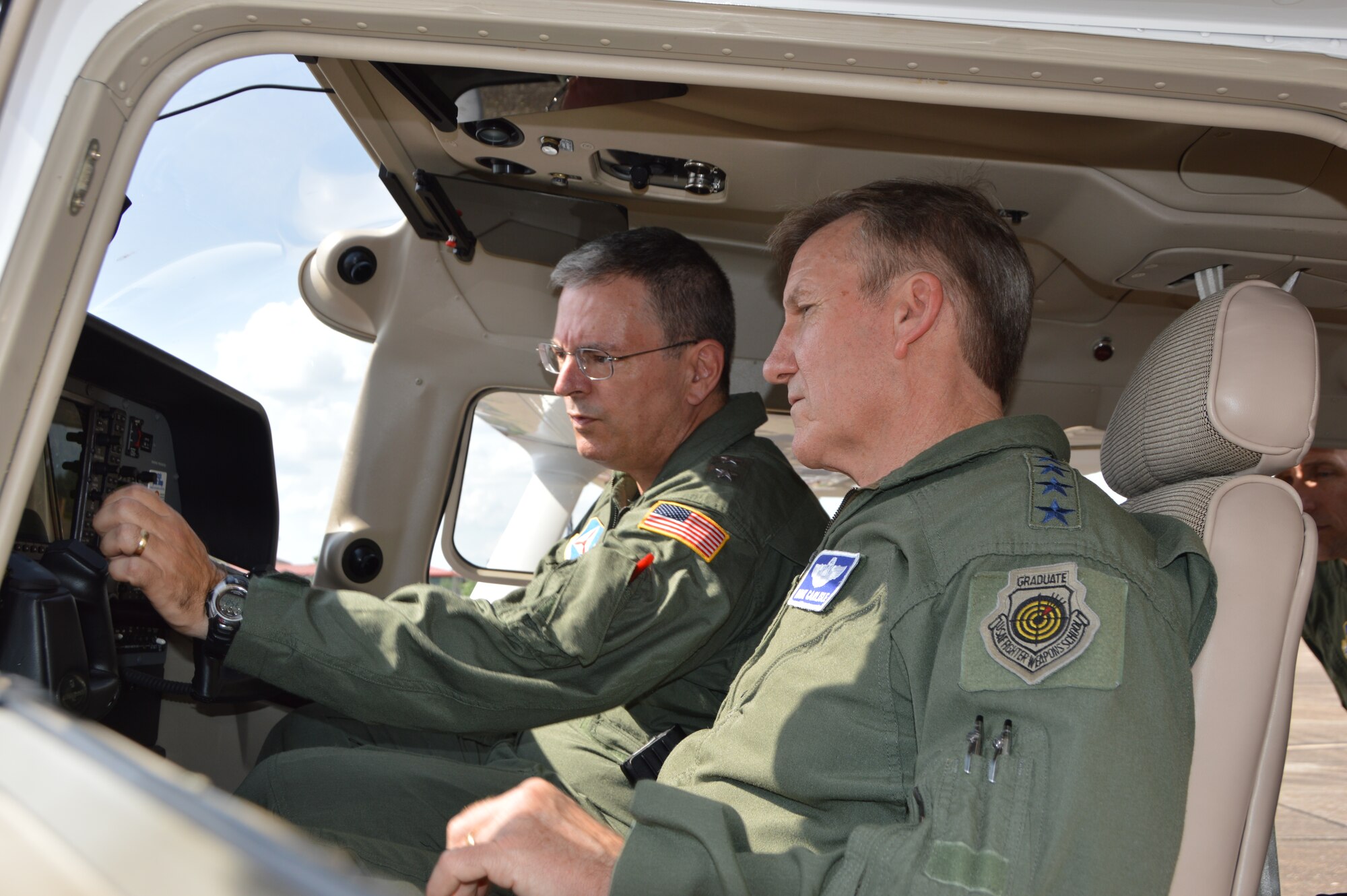 (Left) Maj. Gen. Joseph Vazquez, National Commander of Civil Air Patrol, explains a point about the instruments of a Civil Air Patrol aircraft to Gen. Hawk Carlisle, commander of Air Combat Command, during Carlisle’s visit to CAP National Headquarters at Maxwell Air Force Base, Ala., June 18. Carlisle also met with CAP senior leadership as part of a mission-familiarization visit. (Air Force Photo Released/Mary McHale)