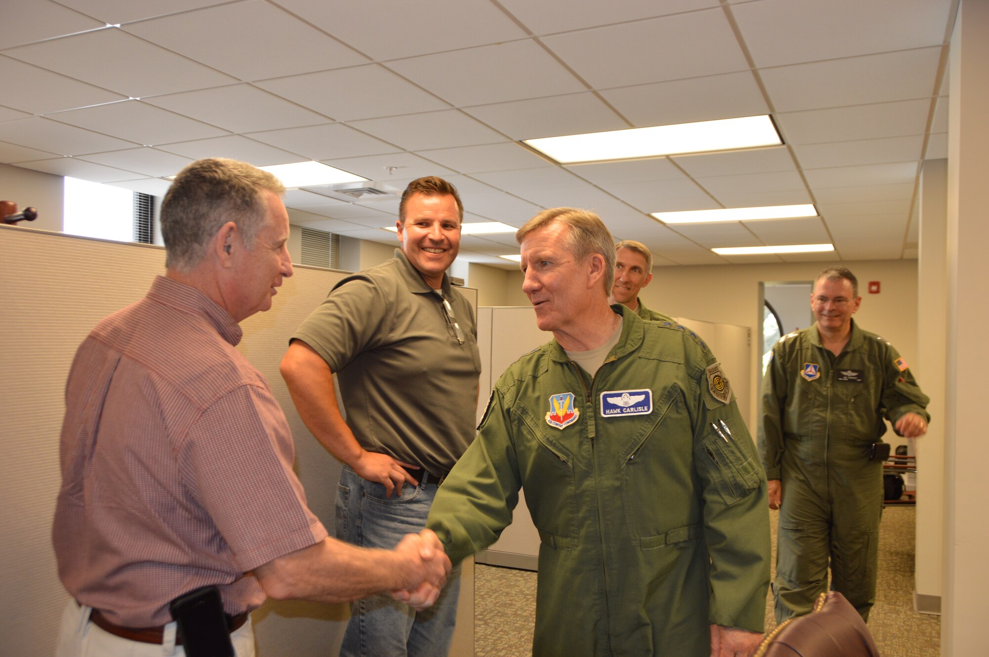 Gen. Hawk Carlisle, commander of Air Combat Command, greets Mark O’brien, 1st Air Force (Air Forces Northern) Civil Air Patrol-U.S. Air Force Liaison Officer, during a visit to CAP National Headquarters at Maxwell Air Force Base, Ala., June 18. While there, the general met with CAP leadership and toured CAP aircraft. (Air Force Photo Released/Mary McHale)