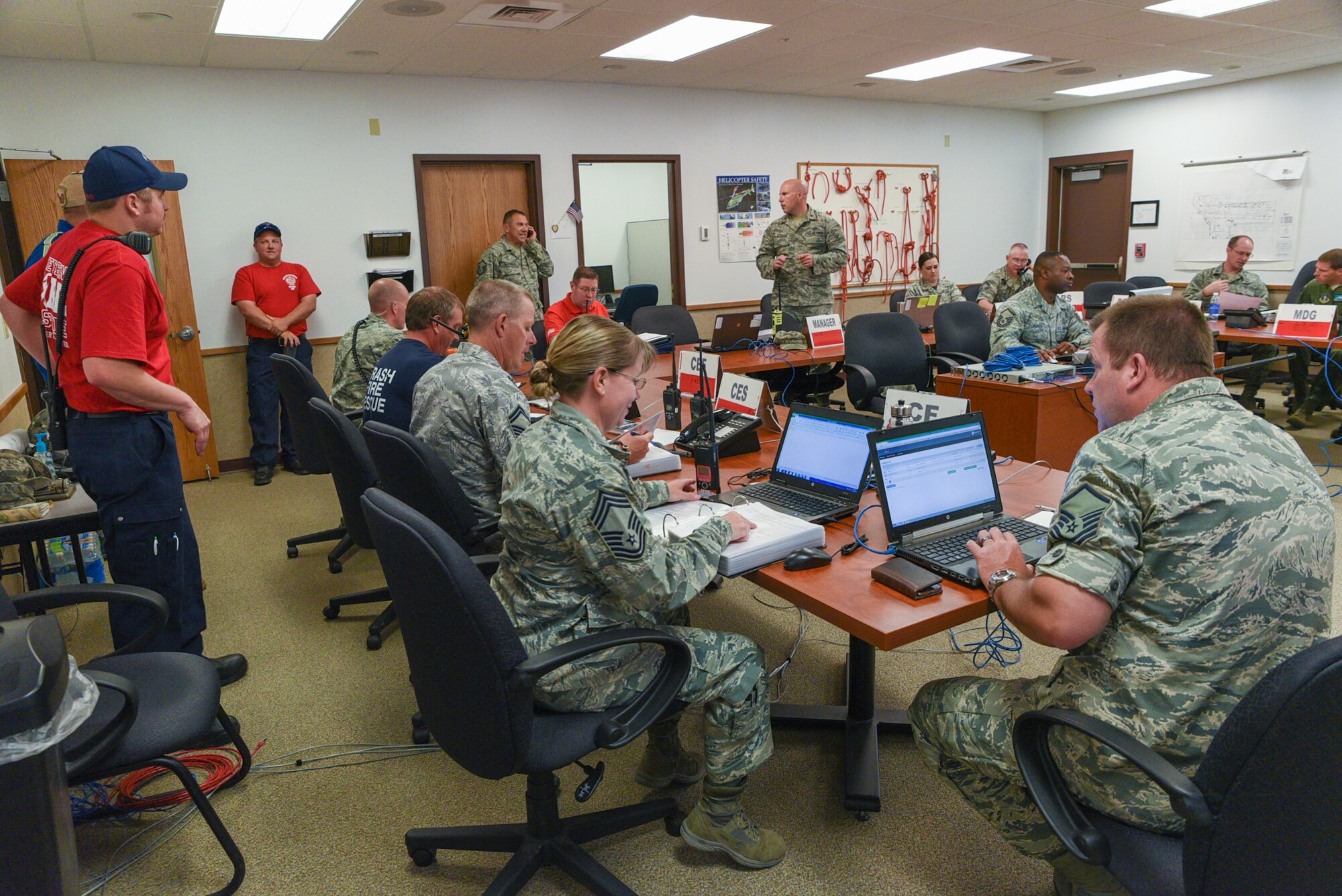 Airmen assigned to the 153rd Airlift Wing Wyoming Air National Guard stand up the emergency operations center in response to a simulated chlorine plume, June 19, 2015, at Cheyenne Air National Guard base in Cheyenne, Wyo. Civilian and military emergency responders are participating in Counter-CBRN All-Hazard Management Response (CAMR) training which provides instruction on chemical, biological, radiological, first response, medical, and incident command for possible threats in the region. (U.S. Air National Guard photo by Master Sgt. Charles Delano)