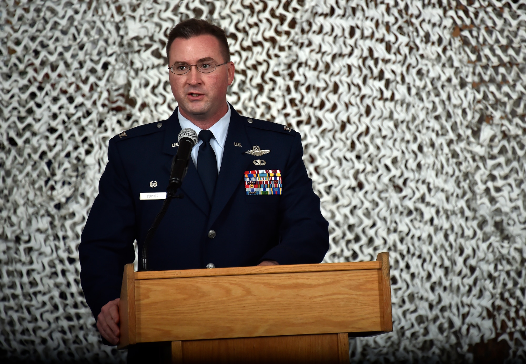 Col. James Copher, commander of the 621st Contingency Response Wing, addresses Airmen and members of the audience during the 621 CRW reorganization capstone ceremony at Joint Base McGuire-Dix-Lakehurst, N.J. June 26, 2015. “Because the amazing people of the CRW remain the same, we’ll retain the most important part of the Devil Raiders: versatile airmen, coming together from different backgrounds, different functional specialties and different personal experiences to form one team and solve complex problems in extreme conditions to execute one mission,” Copher said. (U.S. Air Force photo by Tech. Sgt. Matthew Hannen)