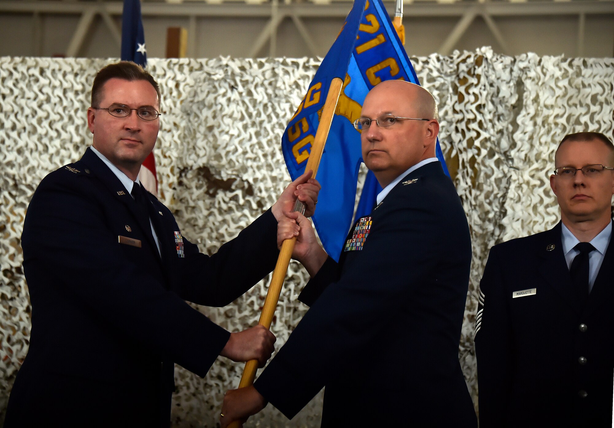 Col. Robert Levin, right, commander of the 621st Contingency Operations Support Group, relinquishes command of the inactivated 621 COSG to Col. James Copher, 621st Contingency Response Wing commander, during the 621 CRW reorganization capstone ceremony at Joint Base McGuire-Dix-Lakehurst, N.J., June 26, 2015. The inactivation signified the completion of the wing’s restructuring initiative to enhance the effectiveness and efficiency of its global air mobility operations. (U.S. Air Force photo by Tech. Sgt. Matthew Hannen)