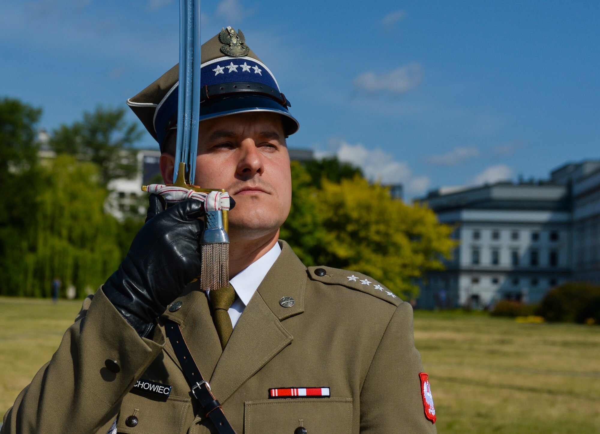 A Polish air force ceremonial guardsman salutes with a saber as Deborah Lee James, Secretary of the U.S. Air Force, participates in a wreath-laying ceremony at the Tomb of the Unknown Soldier in Warsaw, Poland, June 22, 2015. The Secretary completed a visit of installations through Europe June 24, 2015, to meet Airmen, community leaders and allied and partner nation defense chiefs. (U.S. Air Force photo by Staff Sgt. Joe W. McFadden/Released)