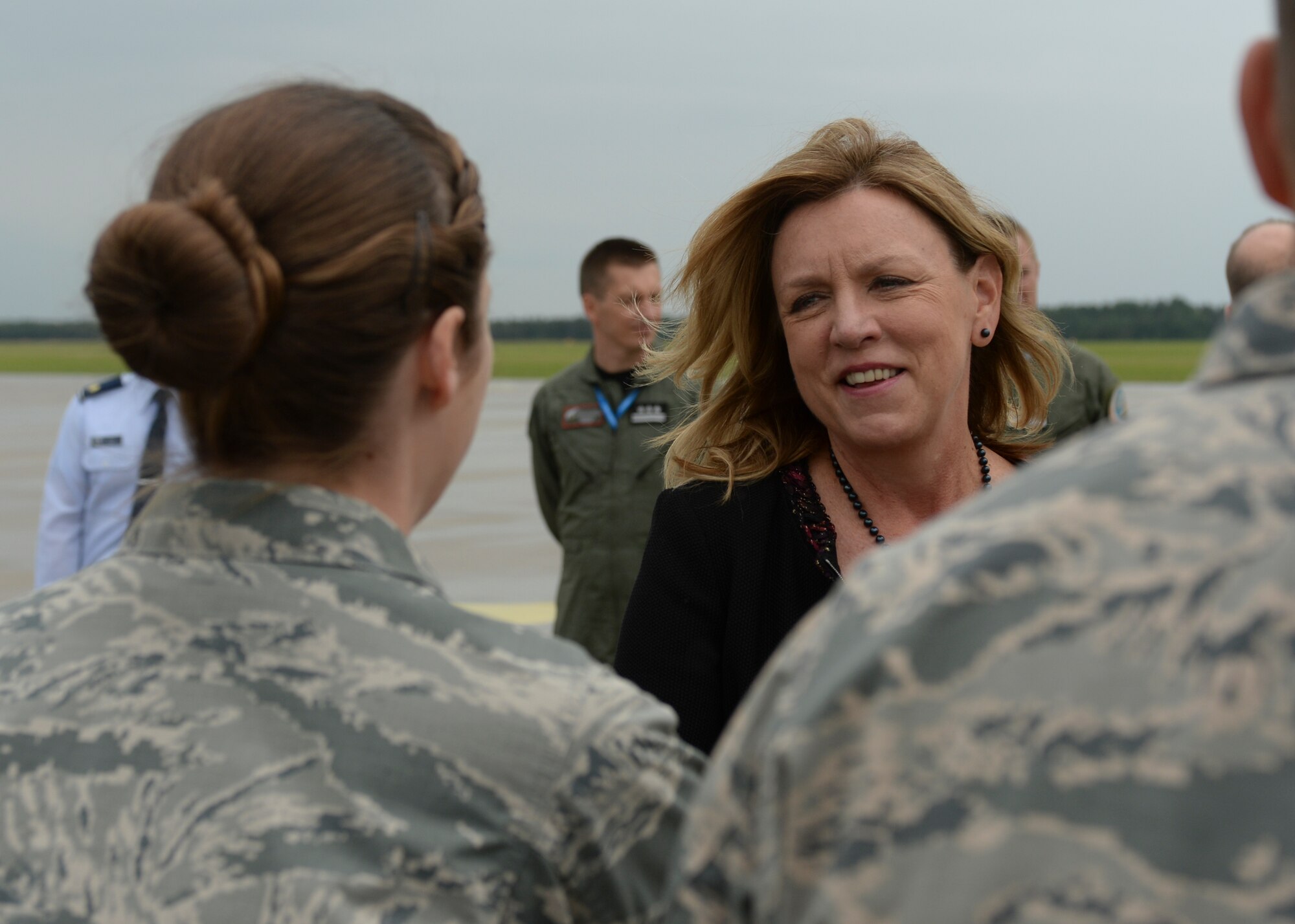 Deborah Lee James, Secretary of the U.S. Air Force, speaks with a U.S. Air Force Airman during a visit to Lask Air Base, Poland, June 22, 2015. The Secretary completed a visit of installations through Europe June 24, 2015, to meet Airmen, community leaders and allied and partner nation defense chiefs. (U.S. Air Force photo by Staff Sgt. Joe W. McFadden/Released)