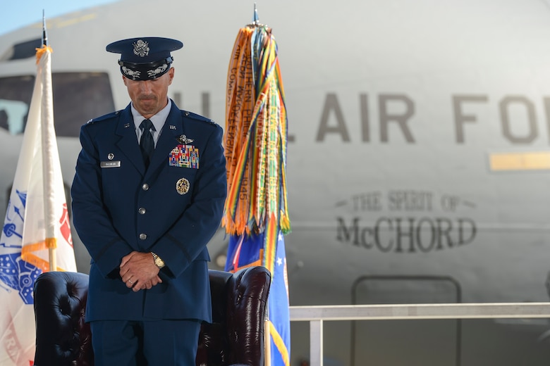 Col. Leonard J. Kosinski, 62nd Airlift Wing commander, bows his head for the invocation during the 62nd AW change of command ceremony June 26, 2015, at Joint Base Lewis-McChord, Wash. Prior to assuming command of the 62nd AW, Kosinski served as the vice commander of the 60th Air Mobility Wing at Travis AFB, Calif. (U.S. Air Force photo/Tech. Sgt. Sean Tobin)