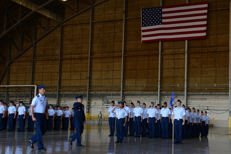 Col. David Kumashiro conducts a ceremonial “inspection of the troops” prior to relinquishing command of the 62nd Airlift Wing, June 26, 2015, at Joint Base Lewis-McChord. Col. Leonard Kosinski assumed command of the 62nd AW. (U.S. Air Force photo by Staff Sgt. Tim Chacon)
