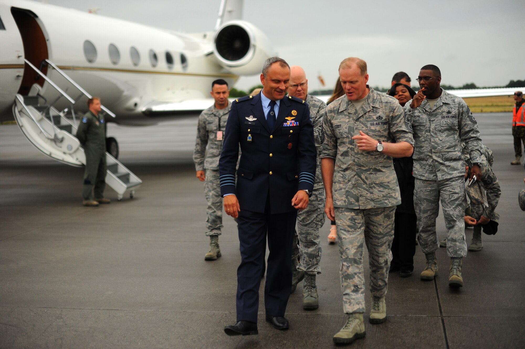 Royal Netherlands Air Force Kolonel Andre Steur, 1st Fighter Wing commander, left, welcomes U.S. Air Force Chief Master Sgt. of the Air Force James Cody for a site visit at Volkel AB, The Netherlands, June 23, 2015. Cody thanked Steur and the Airmen stationed at Volkel for their hard work to secure enduring stability in Europe. (U.S. Air Force photo by Senior Airman Gustavo Castillo/Released) 