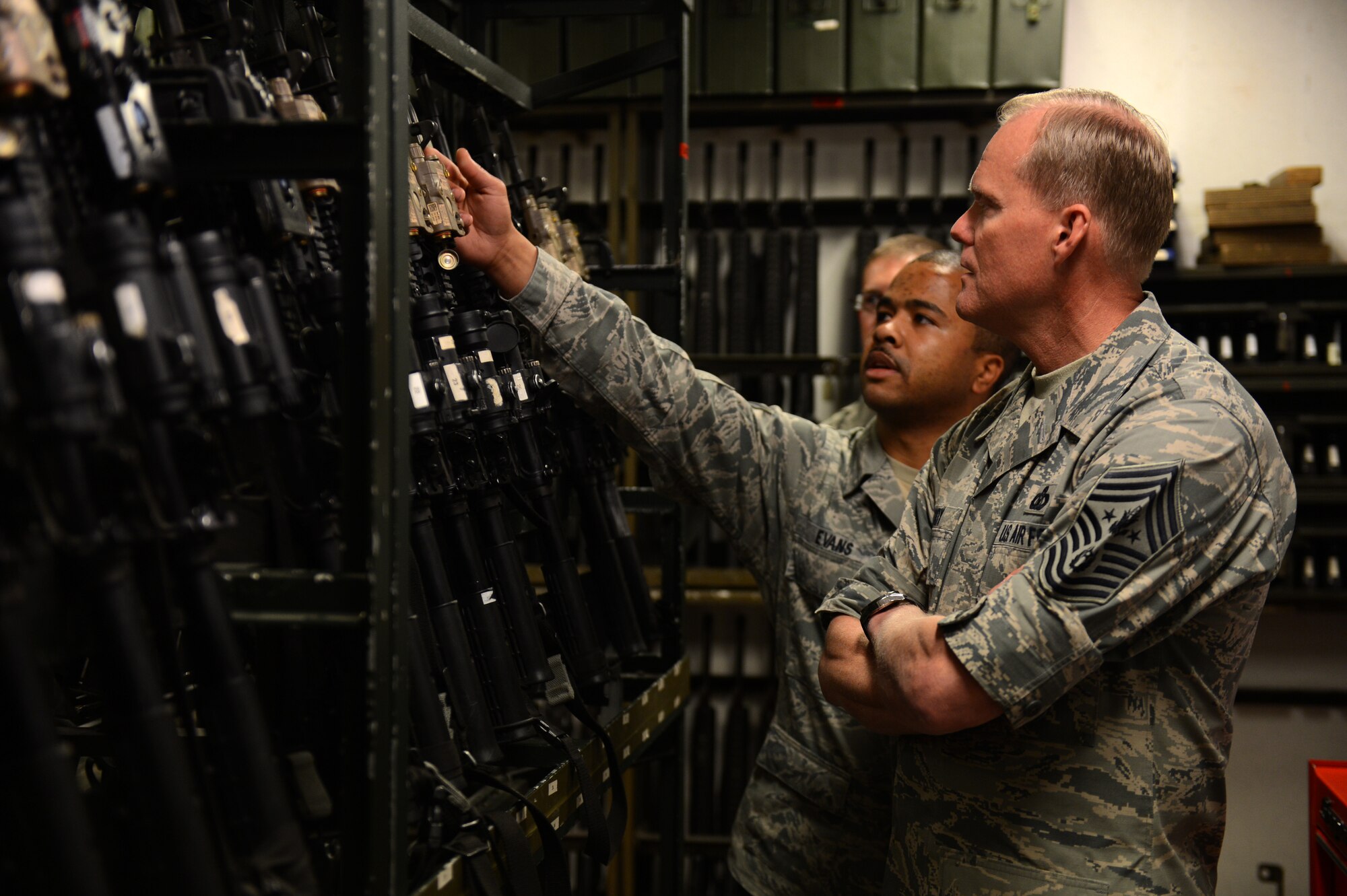 U.S. Air Force Staff Sgt. Alan Evans, 703rd Munitions Support Squadron custody flight sergeant, left, briefs U.S. Air Force Chief Master Sgt. of the Air Force James Cody on mission operations during a site visit at Volkel Air Base, the Netherlands, June 23, 2015. Cody spoke to Airmen in several specialties about mission capabilities and readiness, along with how they are acclimating to living overseas. (U.S. Air Force photo by Senior Airman Gustavo Castillo/Released) 