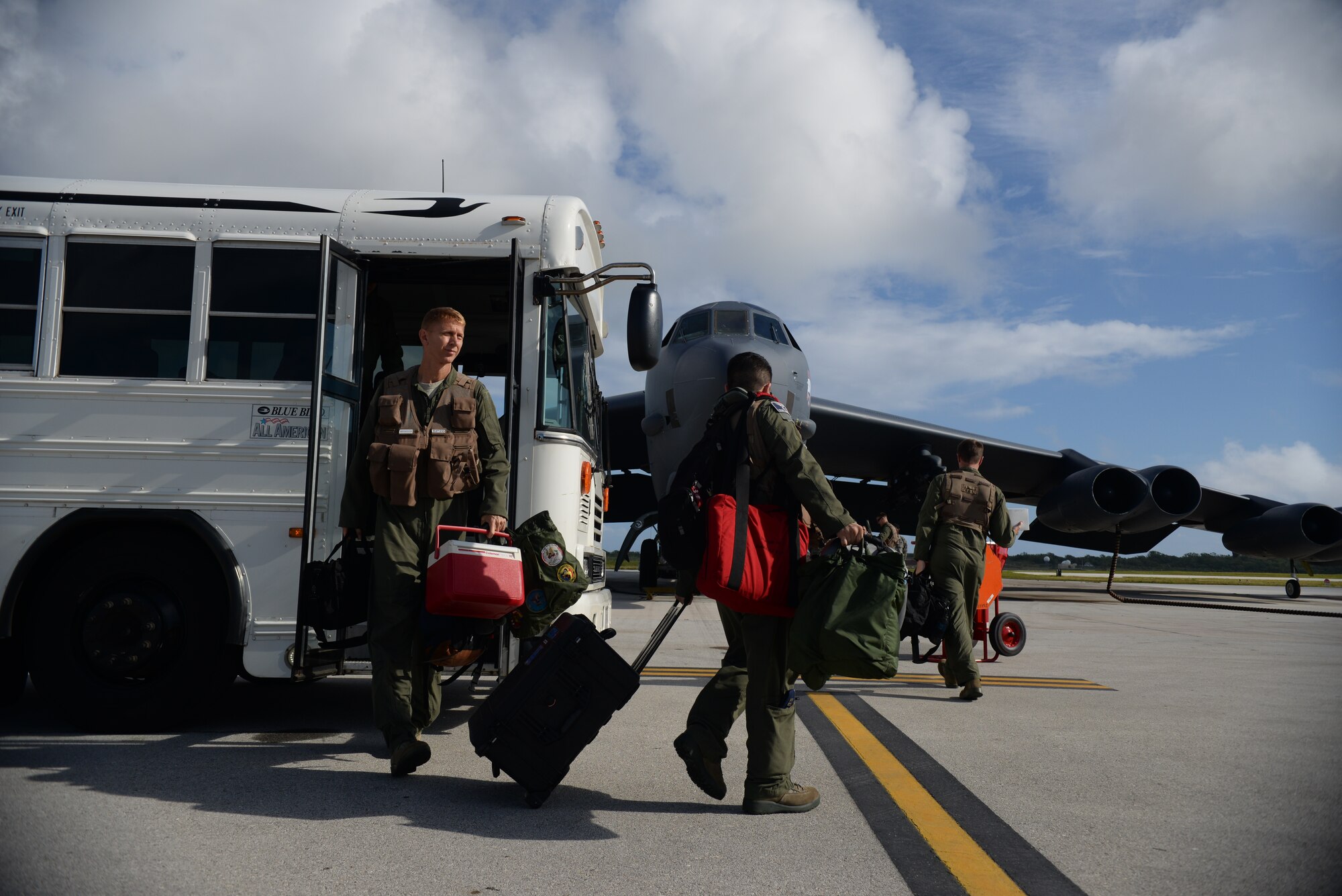Col. Reid Langdon, 36th Operations Group commander, left, and crew arrive on the flightline before his fini-flight June 25, 2015, at Andersen Air Force Base, Guam. A fini-flight marks an aviator’s final official mission on his aircraft. (U.S. Air Force photo by Senior Airman Alexander W. Riedel/Released)