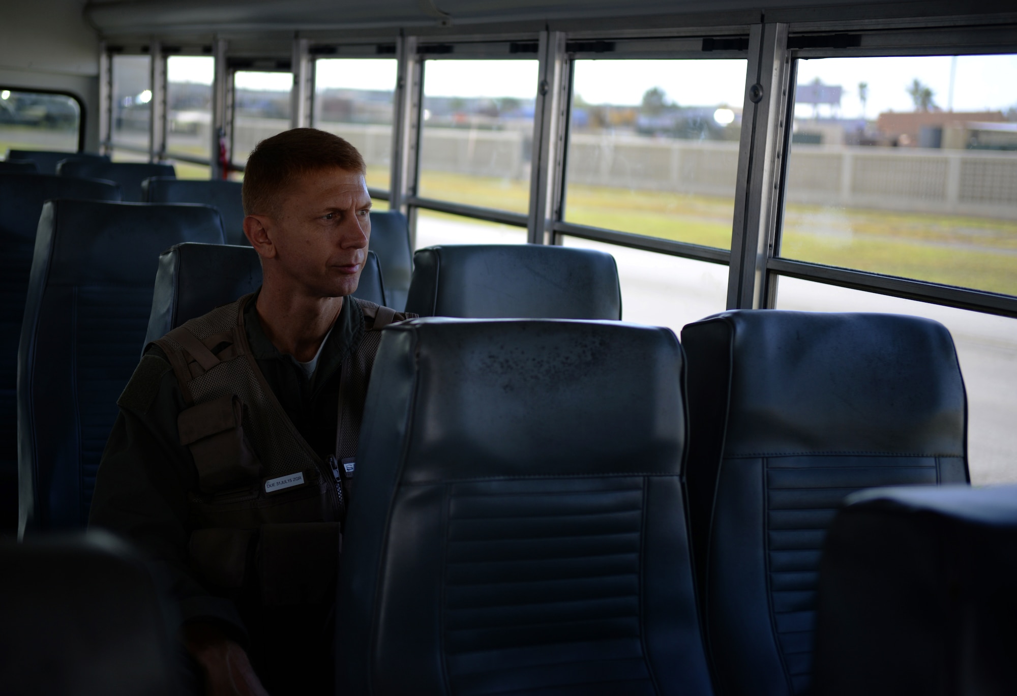 Col. Reid Langdon, 36th Operations Group commander, looks out on the flightline minutes before arriving at his B-52 Stratofortress June 25, 2015, at Andersen Air Force Base, Guam. The training mission marked Langdon’s final flight as a B-52 master navigator. (U.S. Air Force photo by Senior Airman Alexander W. Riedel/Released)
