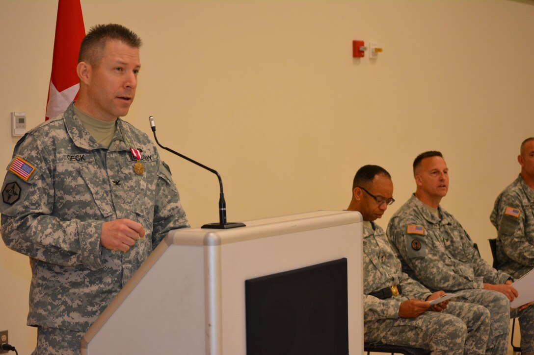 Col. Howard C. W. Geck, former commander, 800th Logistics Support Brigade, delivers his final address to the Soldiers, civilians and family members during a change of command ceremony Mustang, Okla., June 28, 2015. Col. Bradly M. Boganowski replaced Geck as commander.