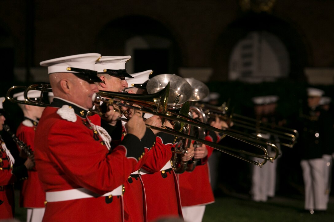The United States Marine Band performs during a Friday Evening Parade at Marine Barracks Washington, D.C., June 26, 2015. The Honorable Pete Visclosky, representative, 1st District of Indiana, and the Honorable Rodney P. Frelinghuysen, representative, 11th district of New Jersey, were the guests of honor at the Evening Parade, and Lt. Gen. Glenn M. Walters, deputy commandant for programs and resources, was the hosting official for that same parade. (Official Marine Corps photo by Cpl. Christian Varney/Released)