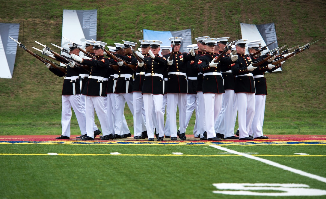 The U.S. Marine Corps Silent Drill Platoon performs at the closing ceremony of the 2015 Department of Defense Warrior Games on Marine Corps Base Quantico, Va., June 28, 2015.