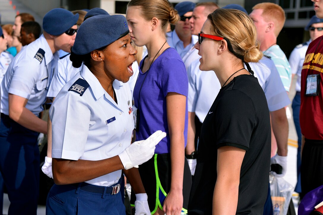 Cadet 2nd Class Angela Ross, left, instructs a basic cadet at the U.S. Air Force Academy in Colorado Springs, Colo., June 25, 2015.