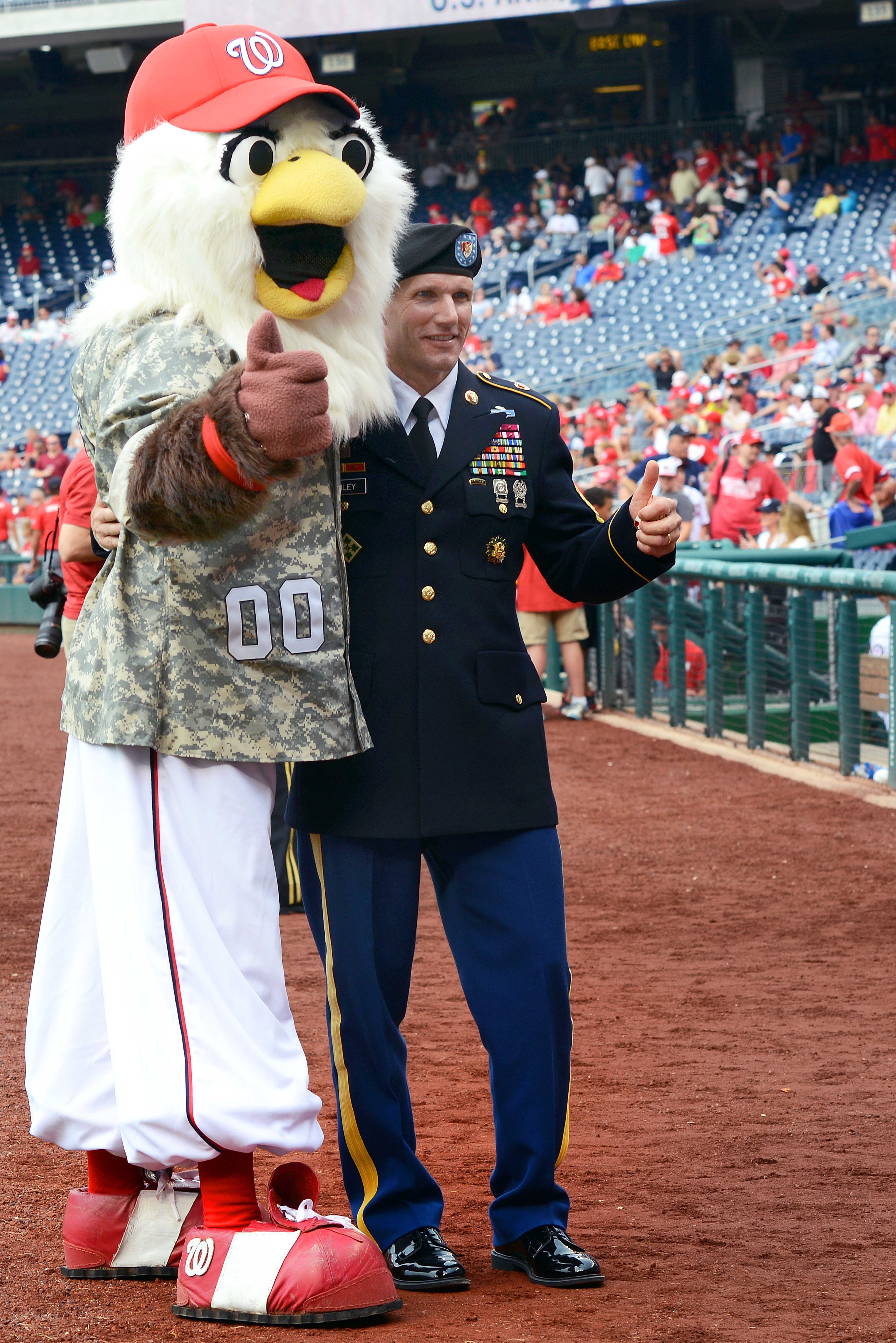 Sgt. Maj. of the Army Daniel A. Dailey poses with Screech, the