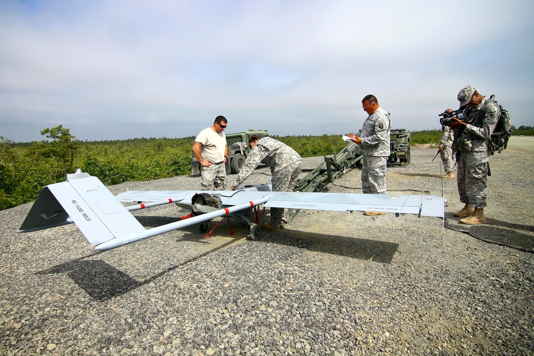 New Jersey National Guard soldiers check an RQ-7 Shadow unmanned aerial vehicle on Warren Grove Gunnery Range, N.J., June 16, 2015.