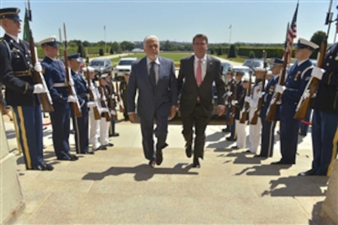 U.S. Defense Secretary Ash Carter, right, hosts an honor cordon to welcome Brazilian Defense Minister  Jaques Wagner to the Pentagon, June 29, 2015. The two defense leaders met to discuss matters of mutual importance.