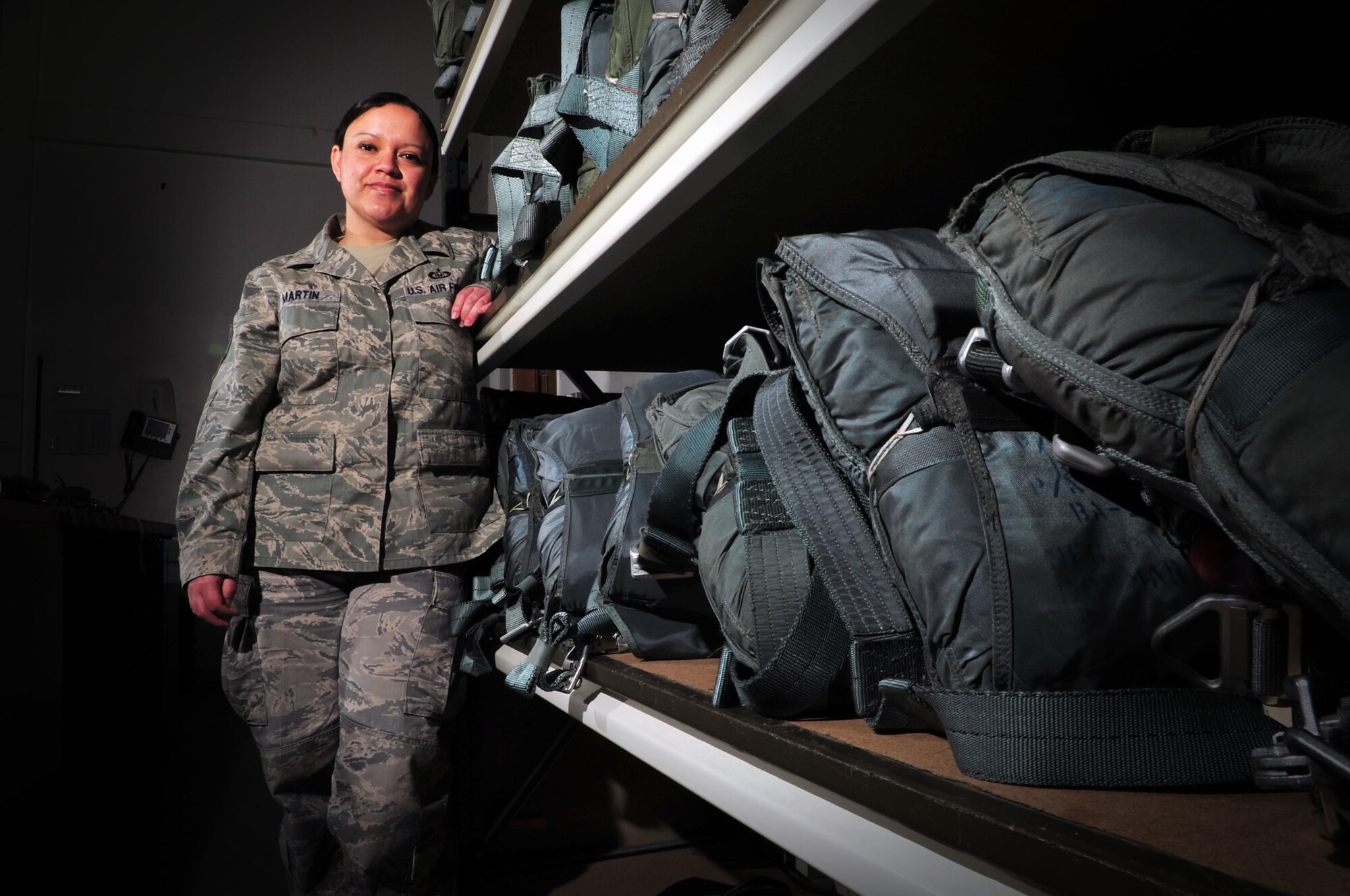 U.S. Air Force Tech. Sgt. Rebeca Martin, 352nd Special Operations Support Squadron NCO in charge of the aircrew flight equipment back-shop, poses for a photo March 14, 2014, at RAF Mildenhall, England. Martin enlisted in the Air Force in February 2001. She and the shop’s Airmen pack more than 300 parachutes and 2,000 lifesaving flotation devices over the course of a year. Martin earned the 2014 “Spirit of Hope Award, Military Program” for Air Force Special Operations Command and the 2014 Air Force LULAC Excellence in Service Award. (U.S. Air Force photo by Senior Airman Christine Griffiths/Released)