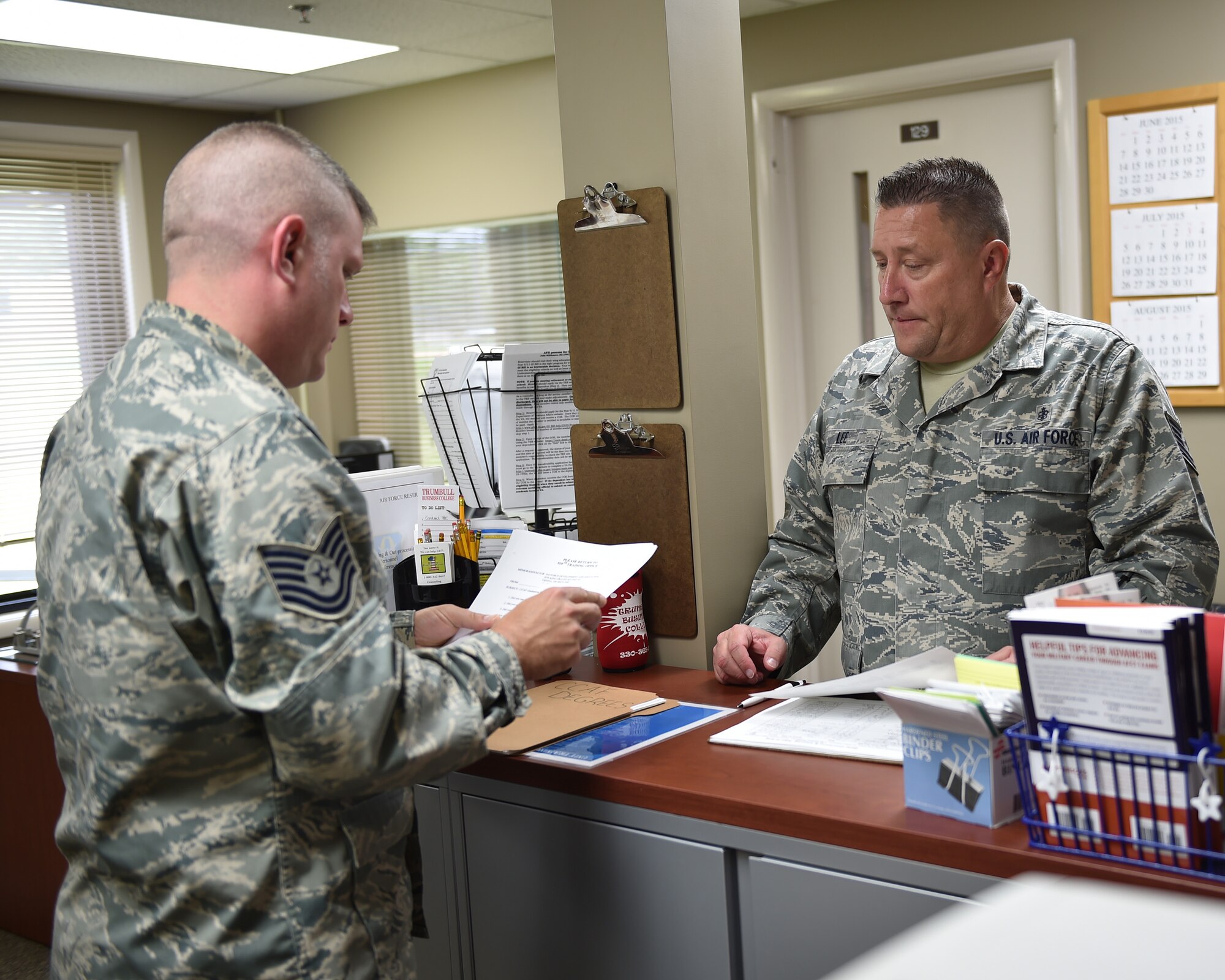 Tech. Sgt. David Pivovar, 910th Force Support Squadron education and training technician, assists Tech. Sgt. James Lee, 910th Medical Squadron insularly medicine superintendent, in getting information for his Community College of the Air Force (CCAF) associate’s degree in Applied Medical Laboratory Technology. CCAF allows Air Force personnel to earn an associate’s degree while service in the military through a combination of job training and experience and academic studies. U.S. Air Force photo/ TSgt Rick Lisum.