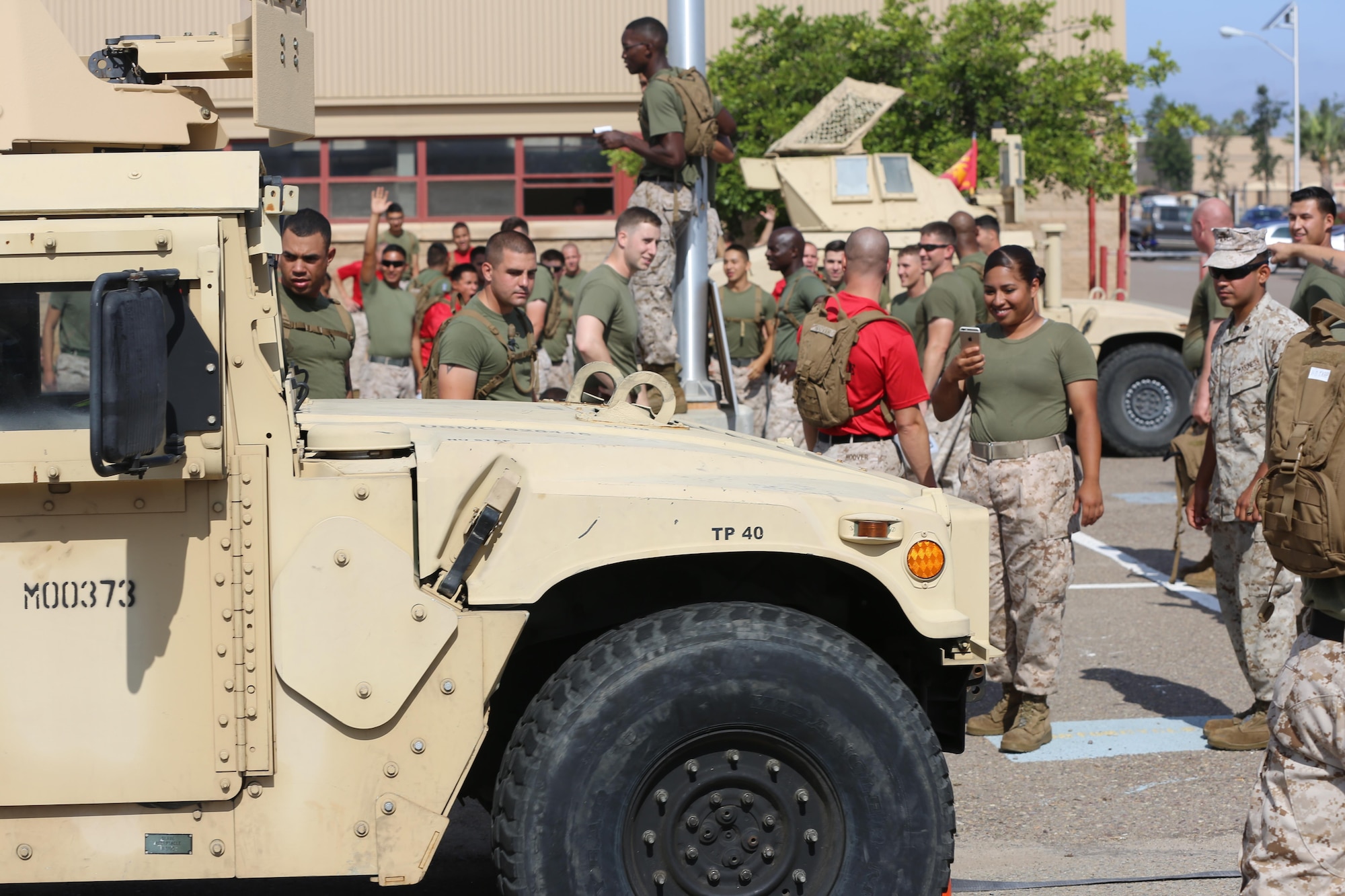 Marines with Marine Wing Support Squadron (MWSS) 373 wait for the results of the Humvee-pull competition during the MWSS-373 Field Meet aboard Marine Corps Air Station Miramar, California, June 26. The field meet commemorates the birthday of the unit. 