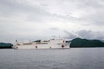 ARAWA, Autonomous Region of Bougainville, Papua New Guinea (June 27, 2015) - The hospital ship USNS Mercy (T-AH 19) steams to its anchorage site off the coast of Arawa, Autonomous Region of Bougainville, Papua New Guinea. Mercy is in Papua New Guinea for its second mission port of Pacific Partnership 2015. Pacific Partnership is in its 10th iteration and is the largest annual multilateral humanitarian assistance and disaster relief preparedness mission conducted in the Indo-Asia-Pacific region. While training for crisis conditions, Pacific Partnership missions to date have provided real world medical care to approximately 270,000 patients and veterinary services to more than 38,000 animals. Additionally, the mission has provided official infrastructure development to host nations through more than 180 engineering projects. 