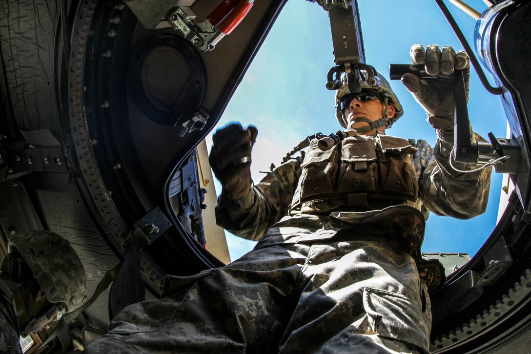An Army reservist prepares for a route clearance mission at the Combat Support Training Exercise Center on Fort McCoy, Wis., June 19, 2015. They used the Husky vehicle-mounted mine detector, the Buffalo mine-resistant, ambush-protected vehicle and the Talon tracked military robot to ensure routes are clear of all roadside bombs. The soldiers are assigned to the Army Reserve’s 323rd Engineering Clearance Company.