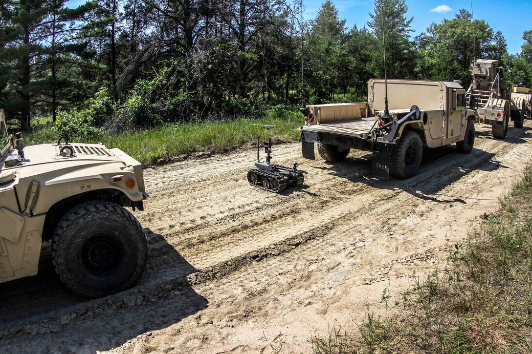 Army reservists use the Talon tracked military robot during a route clearance mission at the Combat Support Training Exercise Center on Fort McCoy, Wis., June 19, 2015.