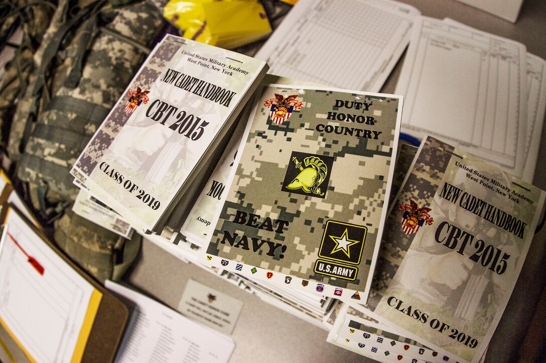 Future cadets arriving at the United States Military Academy at West Point are issued a copy of the new cadet handbook complete with the West Point motto of "Beat Navy" on the back cover on R-day. Almost 1,300 future cadets reported to the Academy on R-day, which is typically held on the last Monday in June. After arriving at the Academy, the future cadets are ushered into Thayer Hall where they are fitted for uniforms and processed into the Academy. ()
