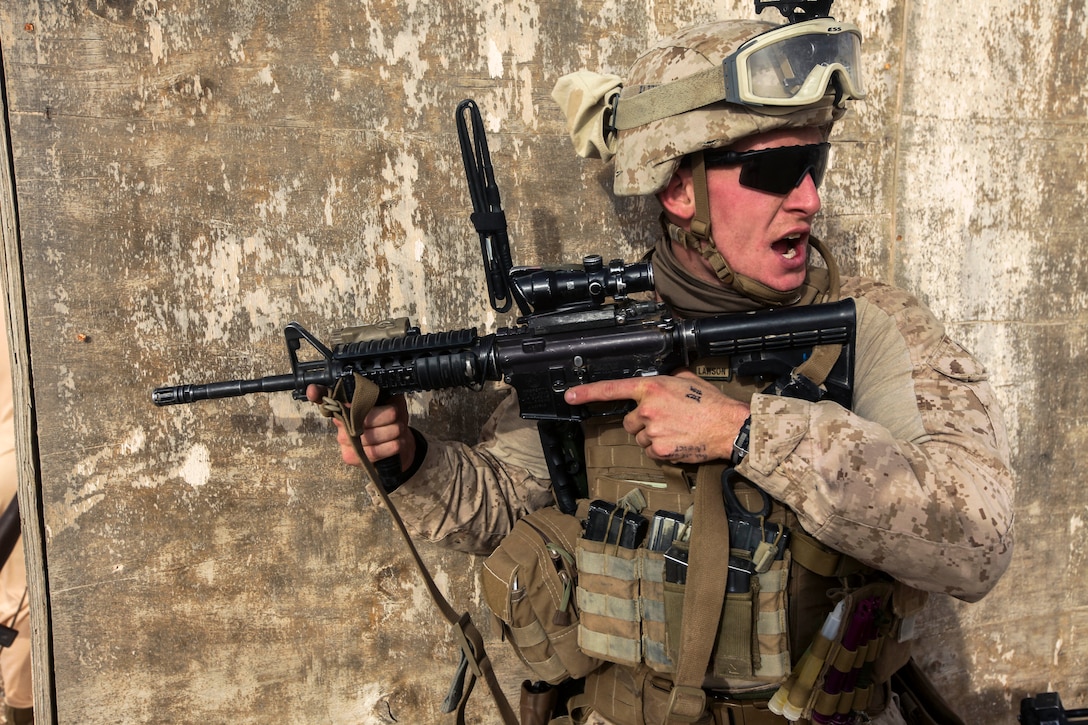 U.S. Marine Corps 1st Lt. Hayden Lawson relays orders to his platoon ...