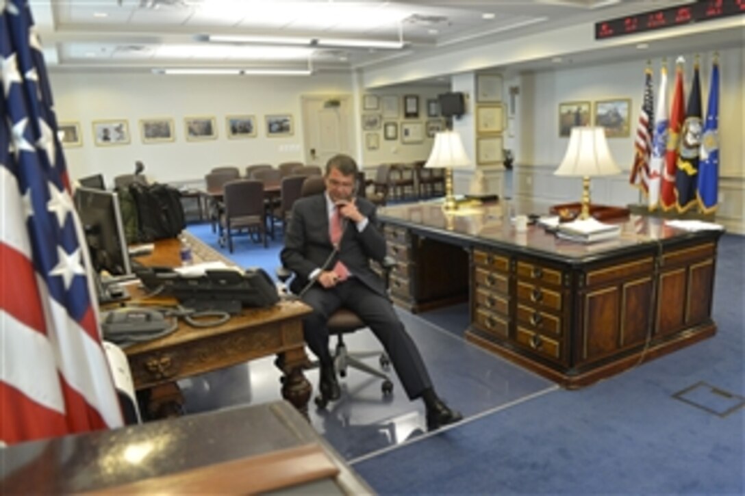 Defense Secretary Ash Carter congratulates Army Sgt. 1st Class Samantha Goldenstein and Capt. Frank Barroqueiro on a call from his office at the Pentagon, June 30, 2015, for leading Team Army to win the Chairman's Cup trophy during the 2015 Department of Defense Warrior Games. Carter also phoned Air Force Master Sgt. Kyle Burnett, who won the Ultimate Champion trophy.