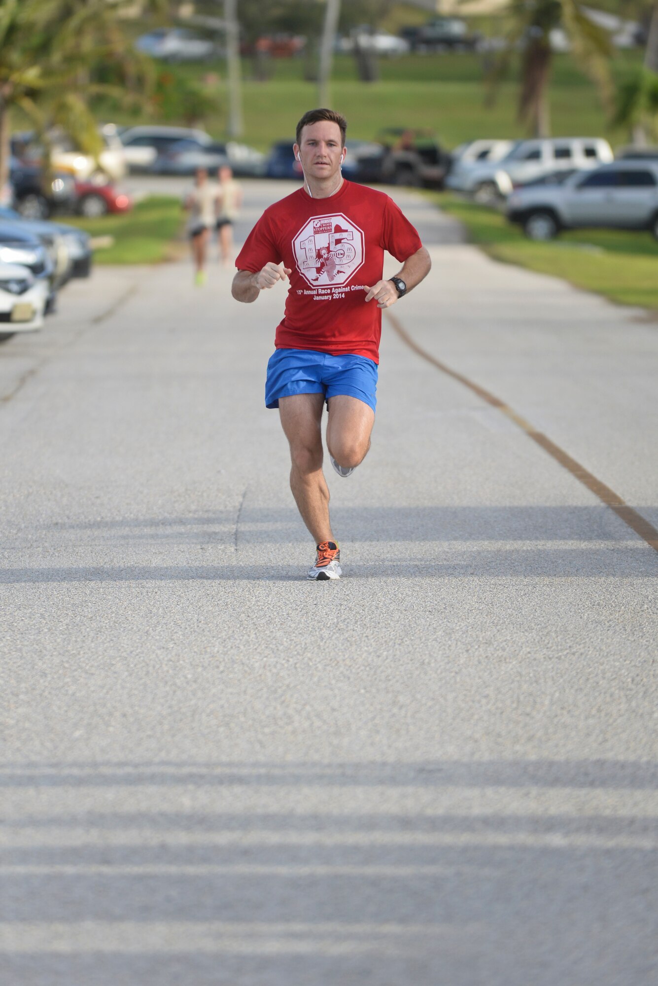 Daniel Guy, race participant, runs toward the finish line during the Red, White and Blue 5K July 1, 2015, at Andersen Air Force Base, Guam. Guy took second place for the males with a time of 19 minutes, 55 seconds. (U.S. Air Force photo by Senior Airman Katrina M. Brisbin/Released)